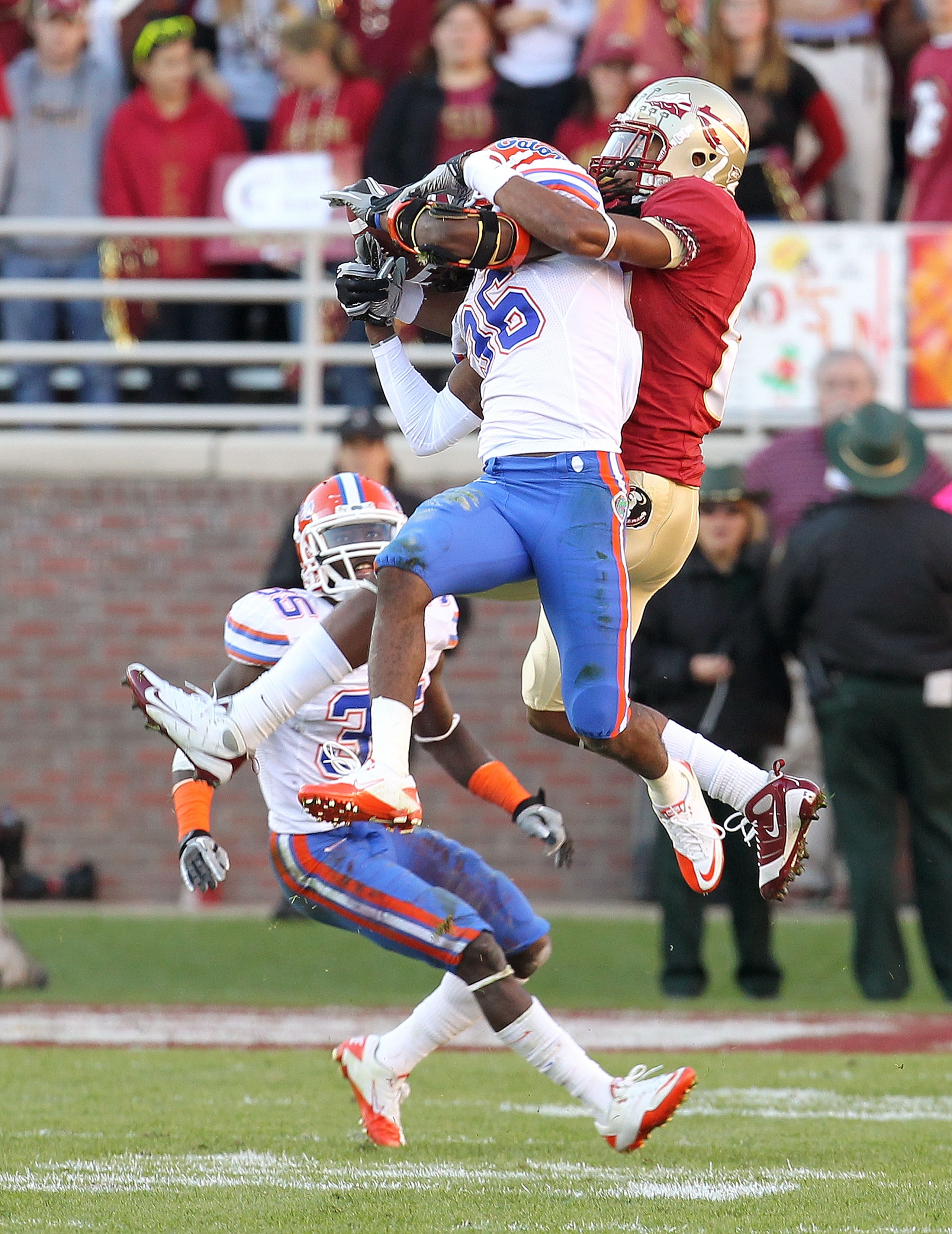 TALLAHASSEE, FL - NOVEMBER 27: Moses Jenkins #36 of the Florida Gators almost intercepts a pass intended for Taiwan Easterling #8 of the Florida State Seminoles during a game at Doak Campbell Stadium on November 27, 2010 in Tallahassee, Florida. (Photo b TALLAHASSEE, FL - NOVEMBER 27: Moses Jenkins #36 of the Florida Gators almost intercepts a pass intended for Taiwan Easterling #8 of the Florida State Seminoles during a game at Doak Campbell Stadium on November 27, 2010 in Tallahassee, Florida. (Photo b