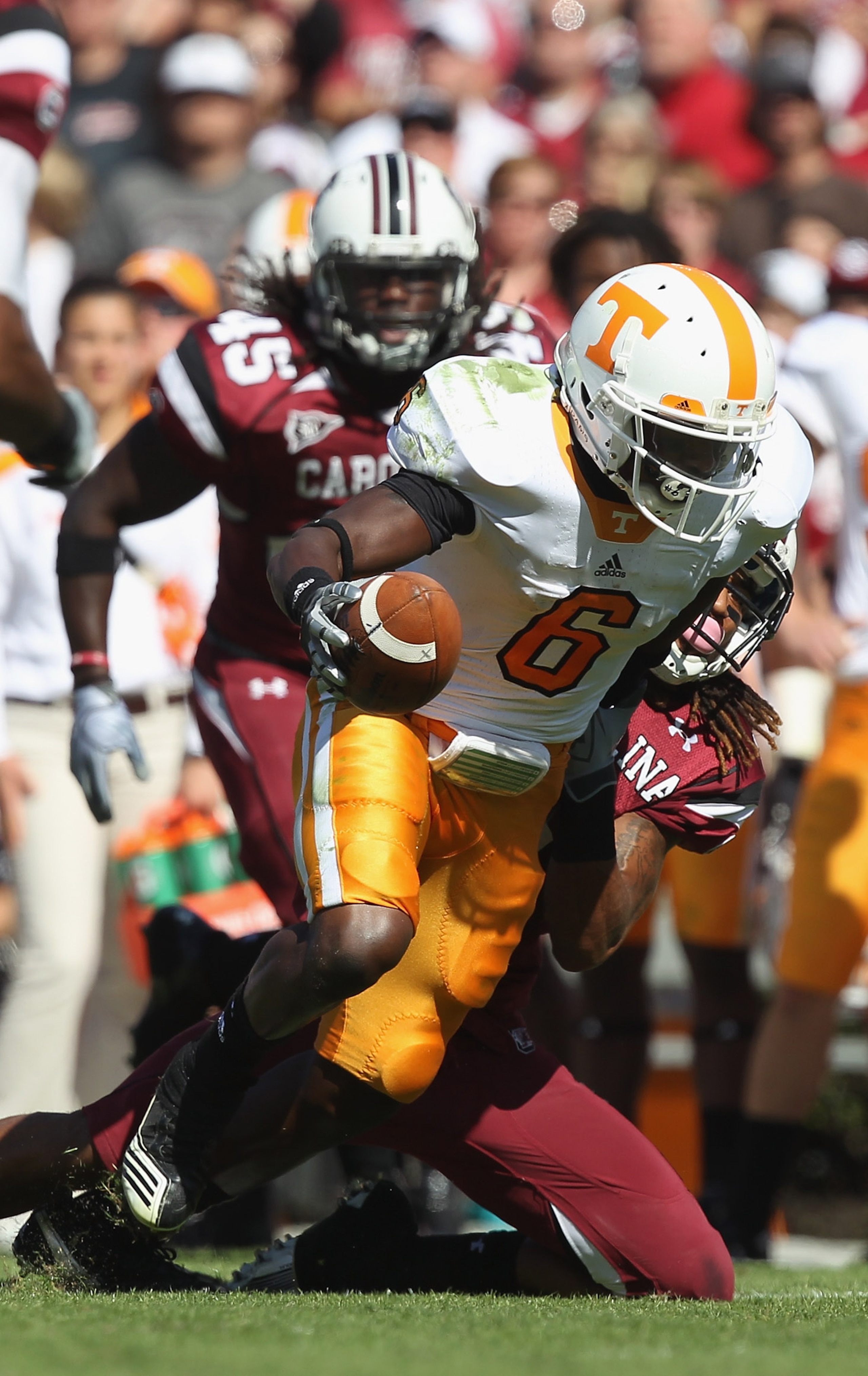 COLUMBIA, SC - OCTOBER 30: Denarius Moore #6 of the Tennessee Volunteers is tackled by Melvin Ingram #6 of the South Carolina Gamecocks during their game at Williams-Brice Stadium on October 30, 2010 in Columbia, South Carolina. (Photo by Streeter Lecka COLUMBIA, SC - OCTOBER 30: Denarius Moore #6 of the Tennessee Volunteers is tackled by Melvin Ingram #6 of the South Carolina Gamecocks during their game at Williams-Brice Stadium on October 30, 2010 in Columbia, South Carolina. (Photo by Streeter Lecka