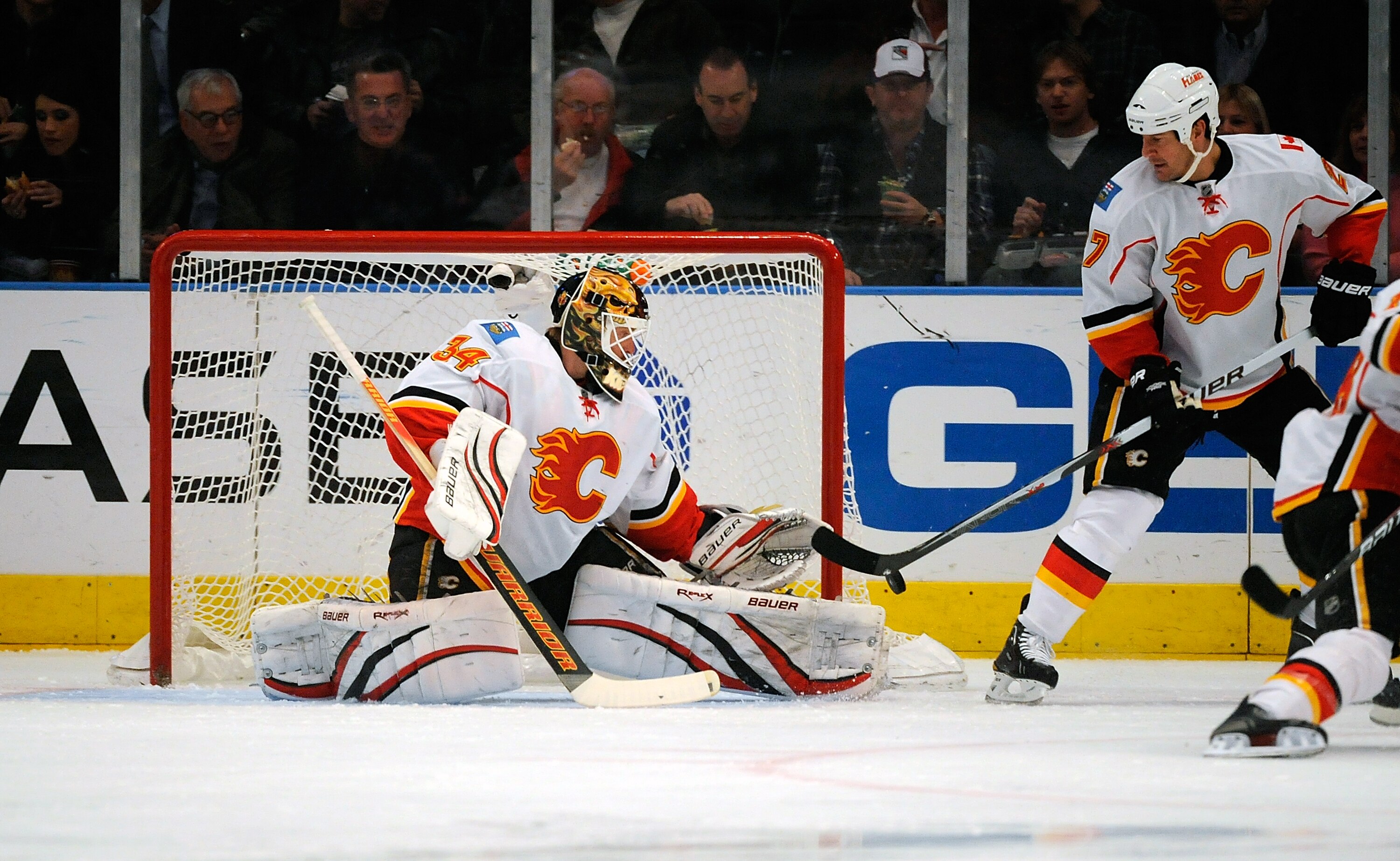 NEW YORK - NOVEMBER 22:  Mikka Kiprusoff  #34 of the Calgary Flames makes a save during a game against the New York Rangers on November 22, 2010 at Madison Square Garden in New York City.  (Photo by Lou Capozzola/Getty Images)