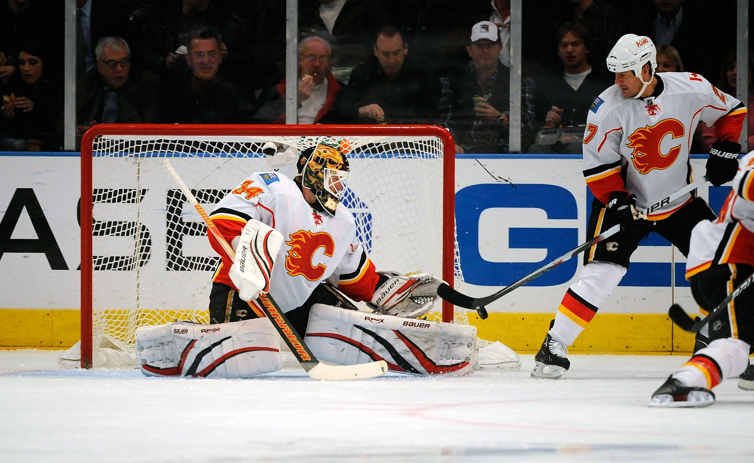 NEW YORK - NOVEMBER 22:  Mikka Kiprusoff  #34 of the Calgary Flames makes a save during a game against the New York Rangers on November 22, 2010 at Madison Square Garden in New York City.  (Photo by Lou Capozzola/Getty Images)