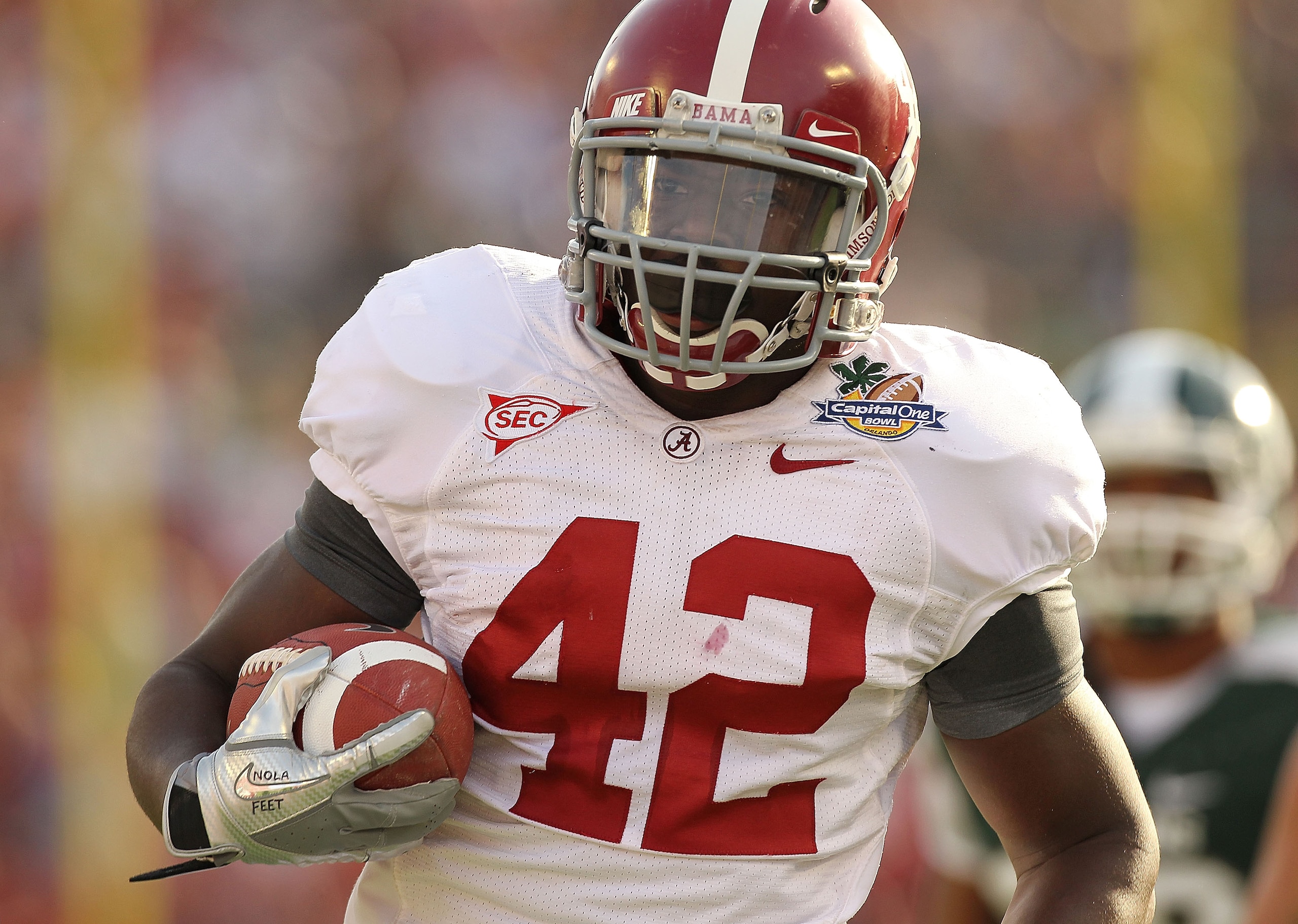 ORLANDO, FL - JANUARY 01: Eddie Lacy #42 of the Alabama Crimson Tide rushes for a touchdown during the Capitol One Bowl against the Michigan State Spartans at the Florida Citrus Bowl on January 1, 2011 in Orlando, Florida. (Photo by Mike Ehrmann/Getty I ORLANDO, FL - JANUARY 01: Eddie Lacy #42 of the Alabama Crimson Tide rushes for a touchdown during the Capitol One Bowl against the Michigan State Spartans at the Florida Citrus Bowl on January 1, 2011 in Orlando, Florida. (Photo by Mike Ehrmann/Getty I