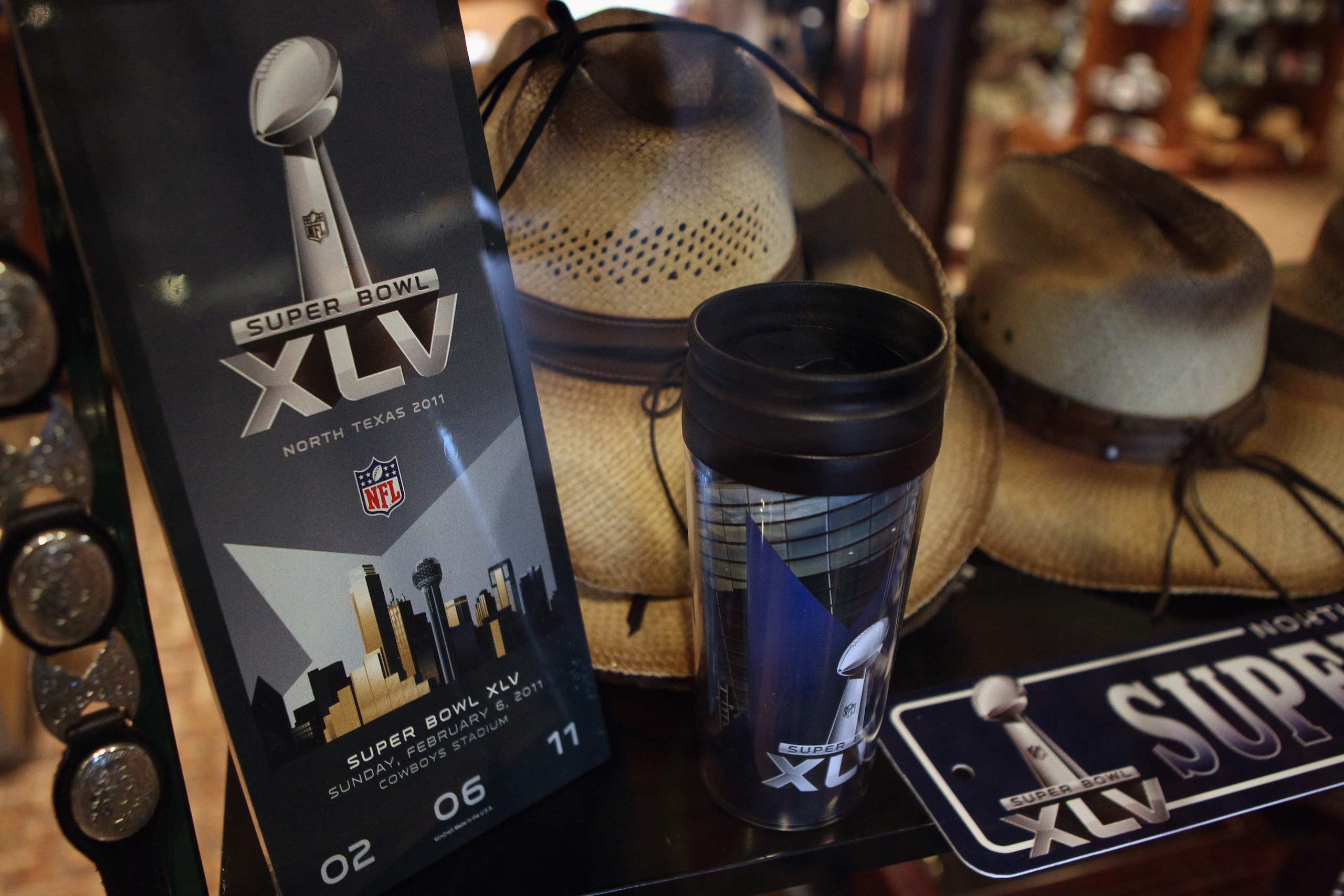 ARLINGTON, TX - FEBRUARY 04:  Super Bowl merchandise sits in a store window ahead of Super Bowl XLV at  on February 4, 2011 in Arlington, Texas.  (Photo by Streeter Lecka/Getty Images)