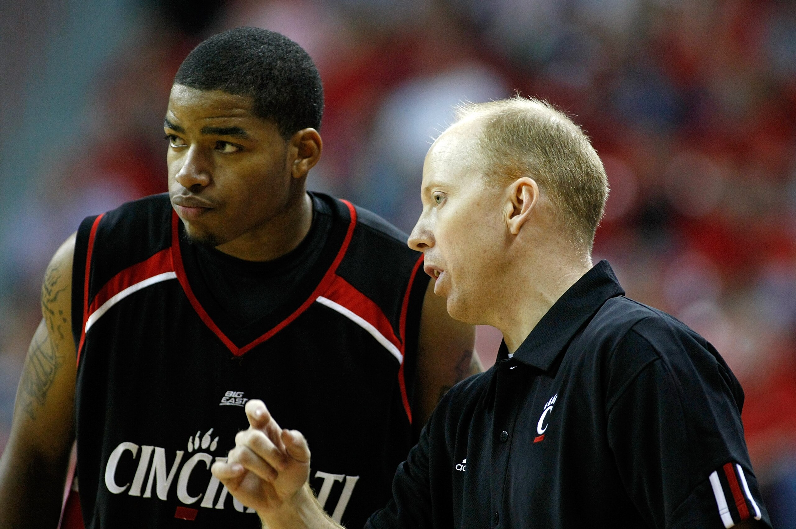 LAS VEGAS - NOVEMBER 29:  Dion Dixon #3 of Cincinnati talks to head coach Mick Cronin during a game against UNLV during the Global Sports Classic tournament at the Thomas & Mack Center November 29, 2008 in Las Vegas, Nevada. Cincinnati won 67-65.  (Photo 