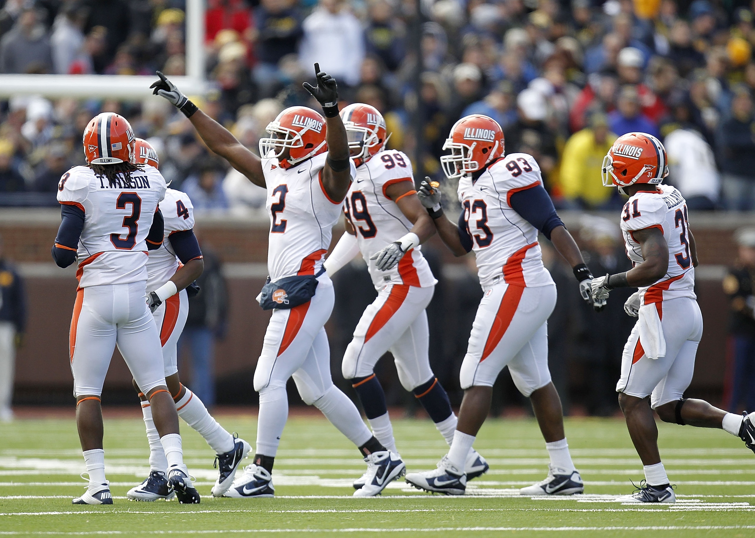 ANN ARBOR, MI - NOVEMBER 06: Martez Wilson #2 of the Illinois Fighting Illini celebrates a first quarter interception with teammates while playing the Michigan Wolverines at Michigan Stadium on November 6, 2010 in Ann Arbor, Michigan. (Photo by Gregory ANN ARBOR, MI - NOVEMBER 06: Martez Wilson #2 of the Illinois Fighting Illini celebrates a first quarter interception with teammates while playing the Michigan Wolverines at Michigan Stadium on November 6, 2010 in Ann Arbor, Michigan. (Photo by Gregory