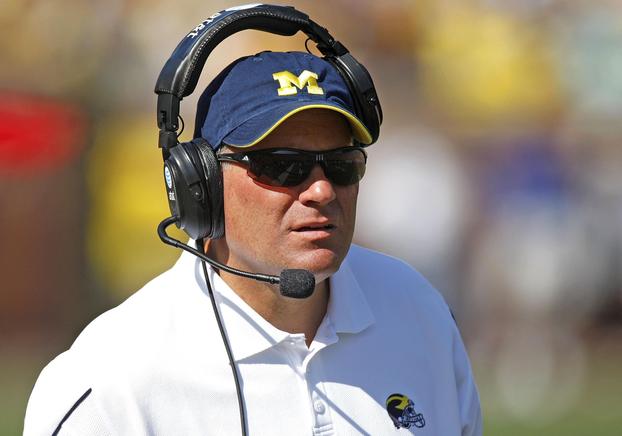 ANN ARBOR, MI - AUGUST 30: Head coach Rich Rodriguez of the Michigan Wolverines looks on during the second quarter while playing the Utah Utes on August 30, 2008 at Michigan Stadium in Ann Arbor, Michigan. (Photo by Gregory Shamus/Getty Images) ANN ARBOR, MI - AUGUST 30: Head coach Rich Rodriguez of the Michigan Wolverines looks on during the second quarter while playing the Utah Utes on August 30, 2008 at Michigan Stadium in Ann Arbor, Michigan. (Photo by Gregory Shamus/Getty Images)