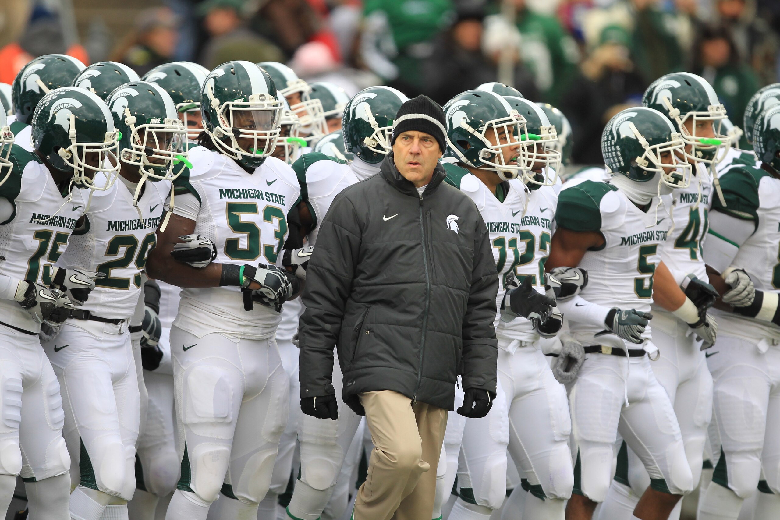 STATE COLLEGE, PA - NOVEMBER 27: Head coach Mark Dantonio of the Michigan State Spartans leads his team onto the field before a game against the Penn State Nittany Lions on November 27, 2010 at Beaver Stadium in State College, Pennsylvania. The Spartans w STATE COLLEGE, PA - NOVEMBER 27: Head coach Mark Dantonio of the Michigan State Spartans leads his team onto the field before a game against the Penn State Nittany Lions on November 27, 2010 at Beaver Stadium in State College, Pennsylvania. The Spartans w