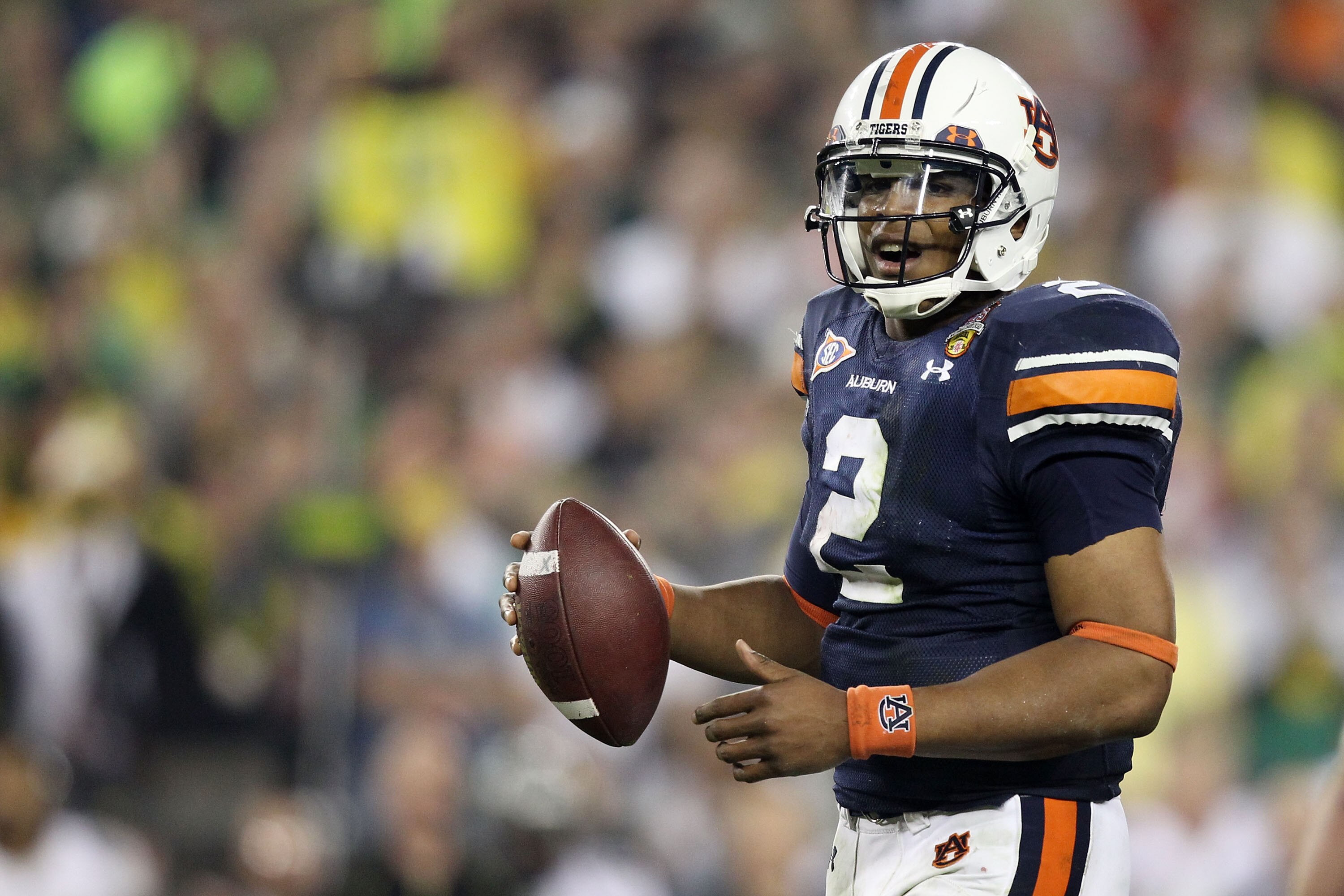 GLENDALE, AZ - JANUARY 10:  Cameron Newton #2 of the Auburn Tigers scrambles against the Oregon Ducks during the Tostitos BCS National Championship Game at University of Phoenix Stadium on January 10, 2011 in Glendale, Arizona.  (Photo by Christian Peters