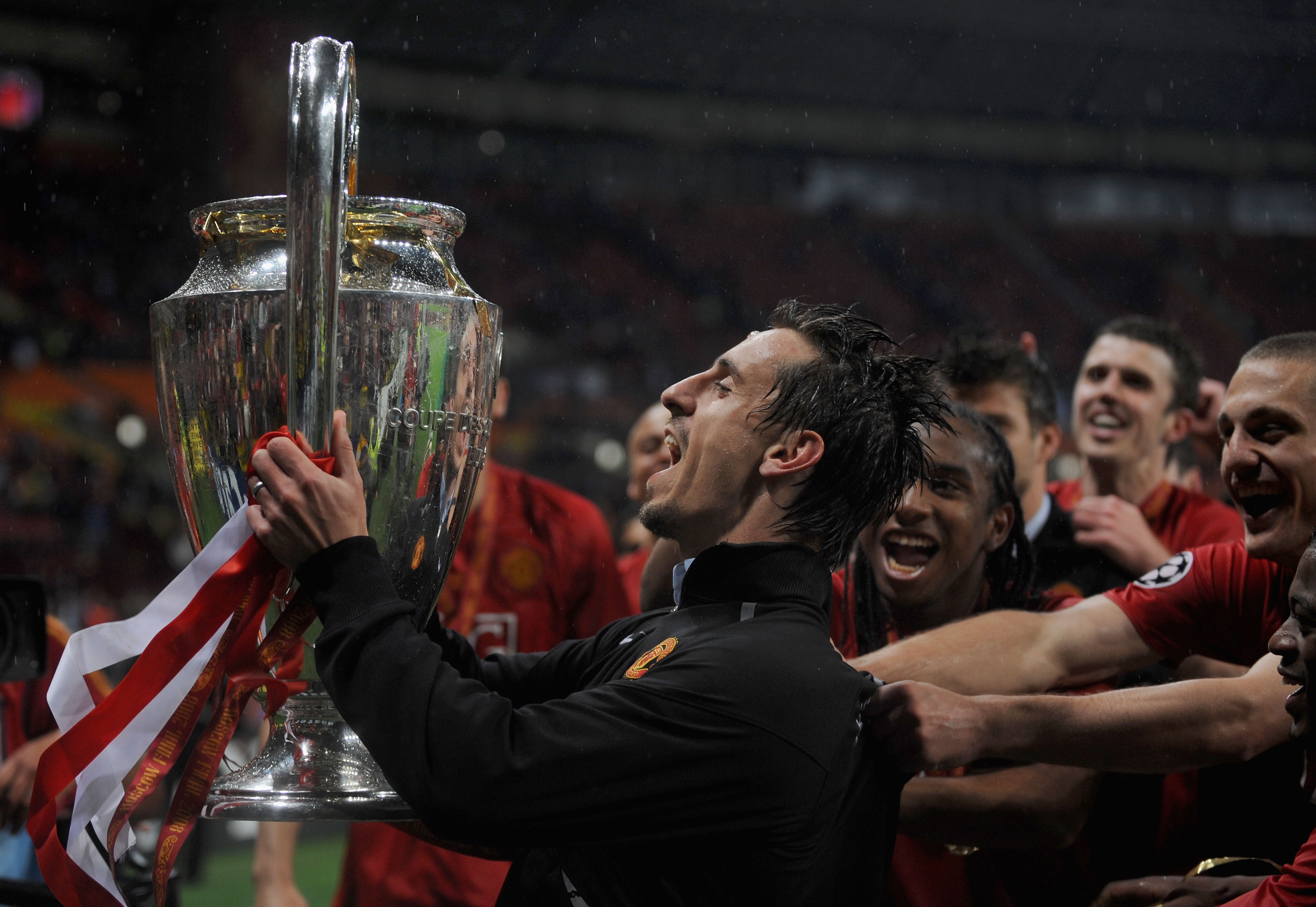 MOSCOW - MAY 21: Gary Neville of Manchester United lifts the trophy during the UEFA Champions League Final match between Manchester United and Chelsea at the Luzhniki Stadium on May 21, 2008 in Moscow, Russia.  (Photo by Shaun Botterill/Getty Images)