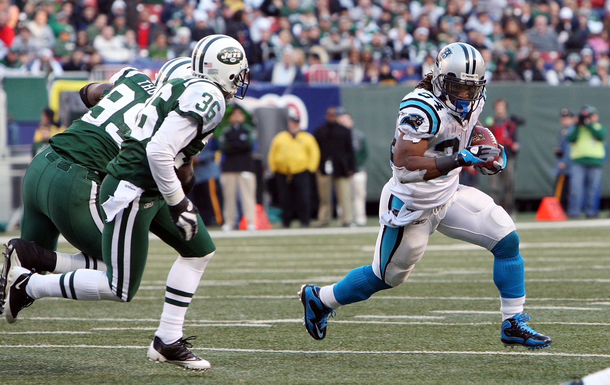 EAST RUTHERFORD, NJ - NOVEMBER 29:  DeAngelo Williams #34 of the Carolina Panthers runs the ball against the New York Jetson November 29, 2009 at Giants Stadium in East Rutherford, New Jersey. The Jets defeated the Panthers 17-6.  (Photo by Jim McIsaac/Ge