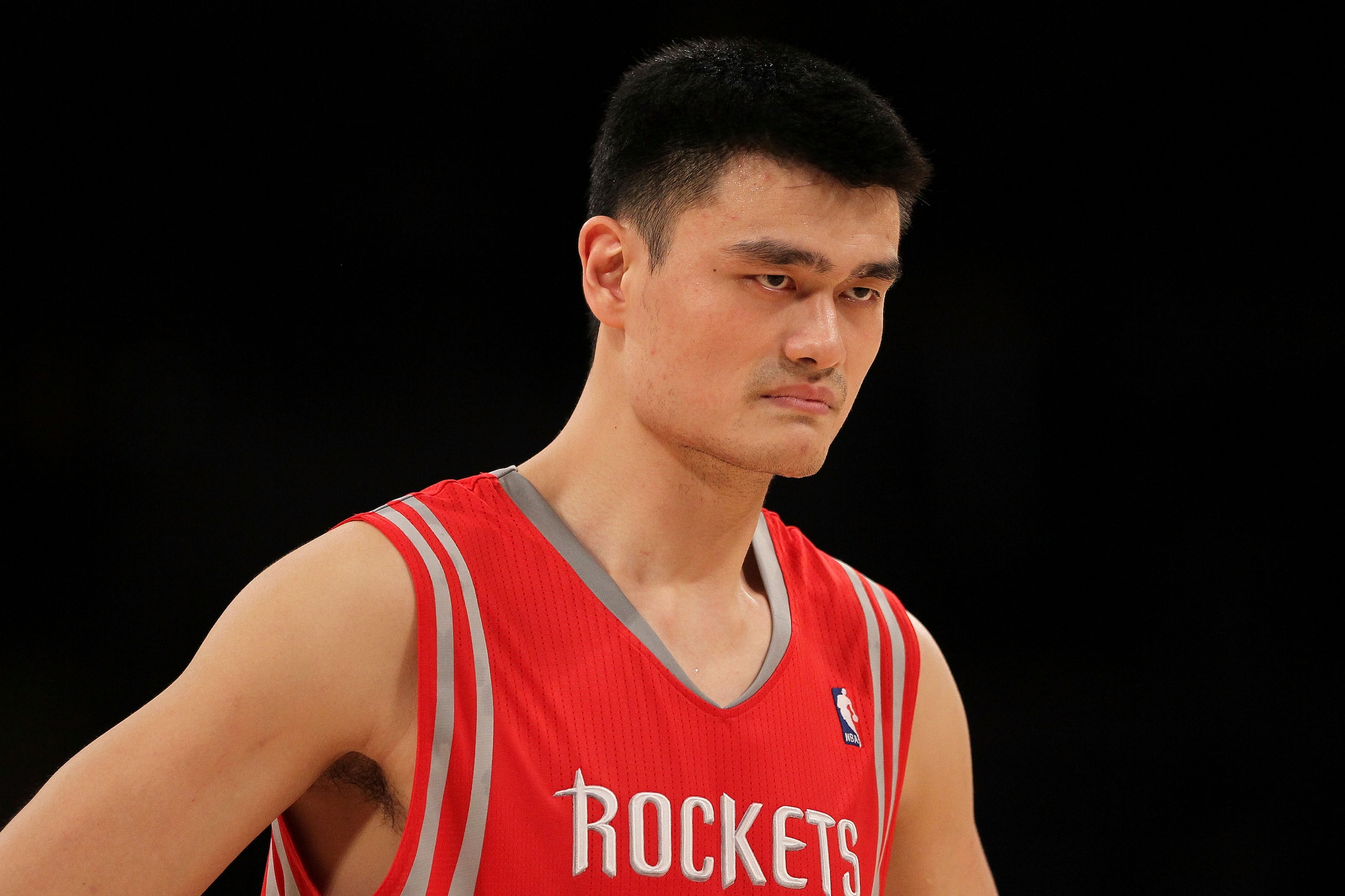 LOS ANGELES, CA - OCTOBER 26: Yao Ming #11 of the Houston Rockets looks on during their opening night game against the Los Angeles Lakers at Staples Center on October 26, 2010 in Los Angeles, California. NOTE TO USER: User expressly acknowledges and agre LOS ANGELES, CA - OCTOBER 26: Yao Ming #11 of the Houston Rockets looks on during their opening night game against the Los Angeles Lakers at Staples Center on October 26, 2010 in Los Angeles, California. NOTE TO USER: User expressly acknowledges and agre