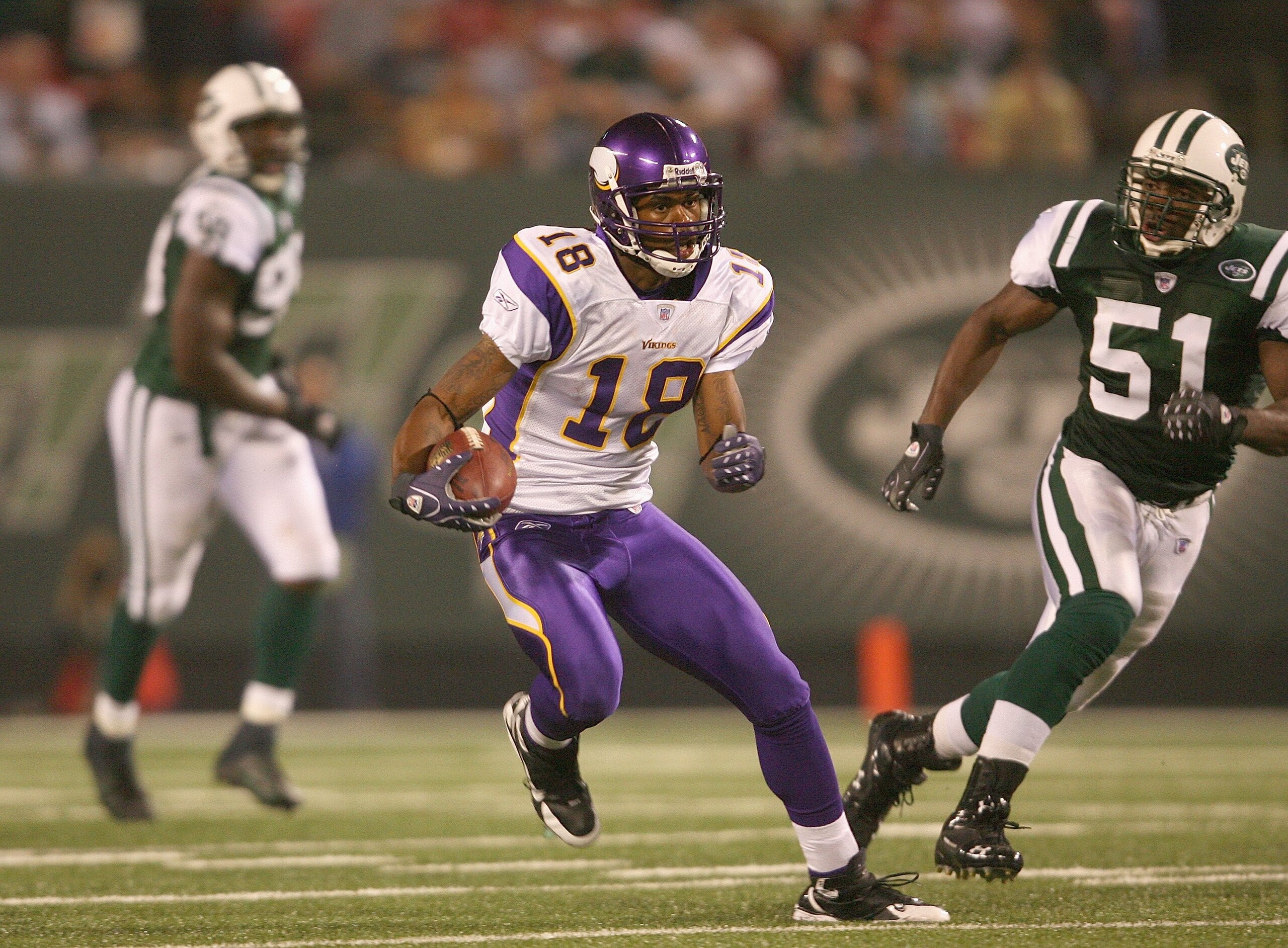 EAST RUTHERFORD, NJ - AUGUST 17:  Sidney Rice #18 of the Minnesota Vikings carries the ball against Jonathan Vilma #51 of the New York Jets during their preseason game on August 17, 2007 at Giants Stadium in East Rutherford, New Jersey. The Jets won 31-16