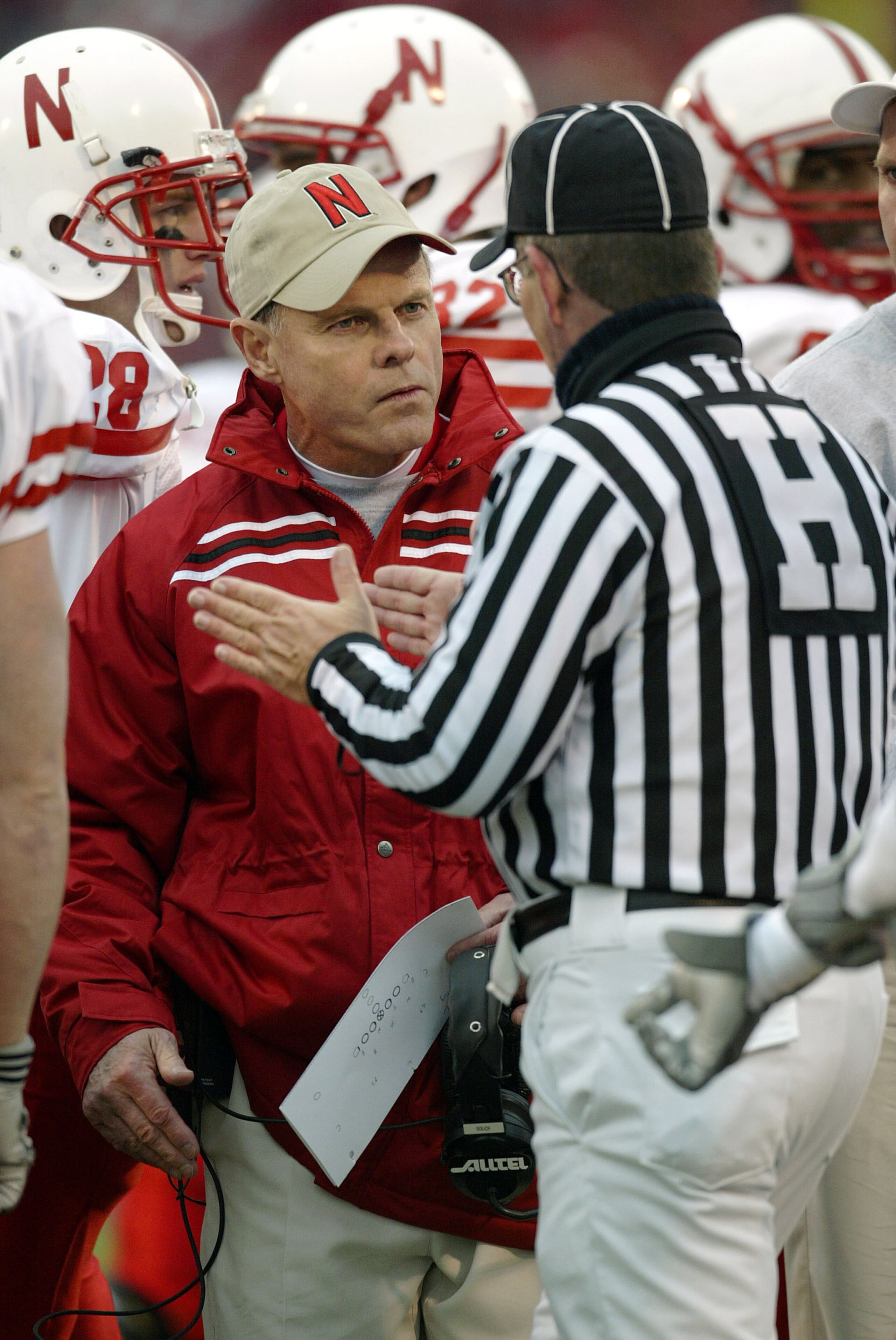 LAWRENCE, KS - NOVEMBER 8:  Head coach Frank Solich of the Nebraska Cornhuskers questions head linesman Dave Alexander after the Cornhuskers lost possession on a fumble that rolled into the endzone for a touchback for the Kansas Jay Hawks in the second qu