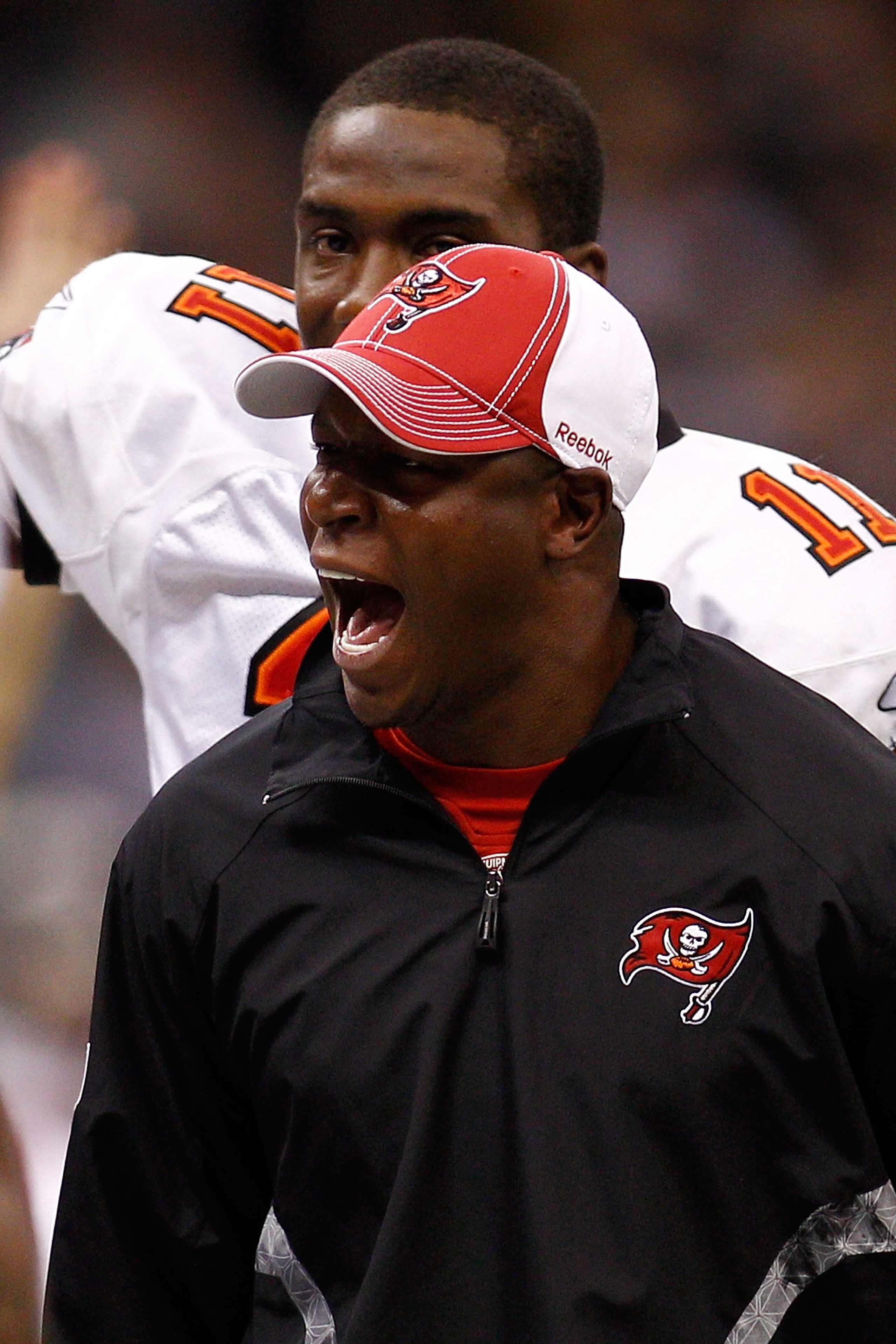NEW ORLEANS, LA - JANUARY 02:  Head coach Raheem Morris of the Tampa Bay Buccaneers celebrates after a touchdown during the game against the New Orleans Saintsat the Louisiana Superdome on January 2, 2011 in New Orleans, Louisiana.  (Photo by Chris Grayth