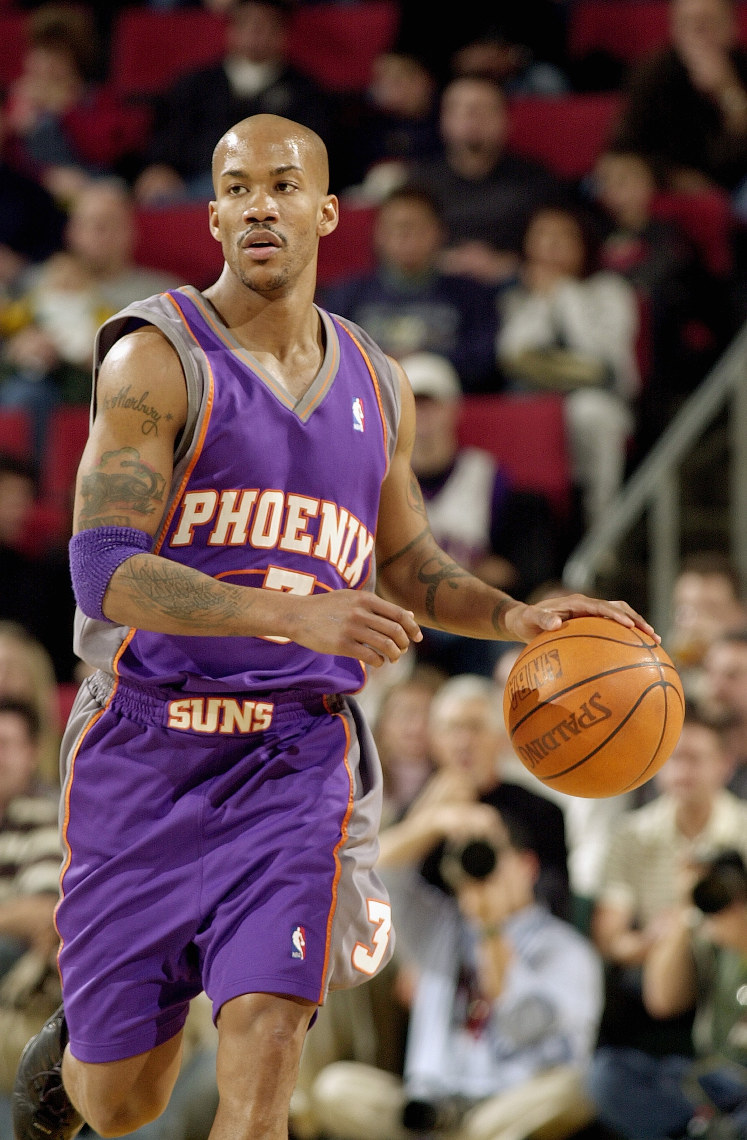 SEATTLE - DECEMBER 23:  Stephon Marbury #3 of the Phoenix Suns moves the ball during the game against the Seattle Sonics on December 23, 2003 at Key Arena in Seattle, Washington.  The Sonics won 116-90.  NOTE TO USER: User expressly acknowledges and agree