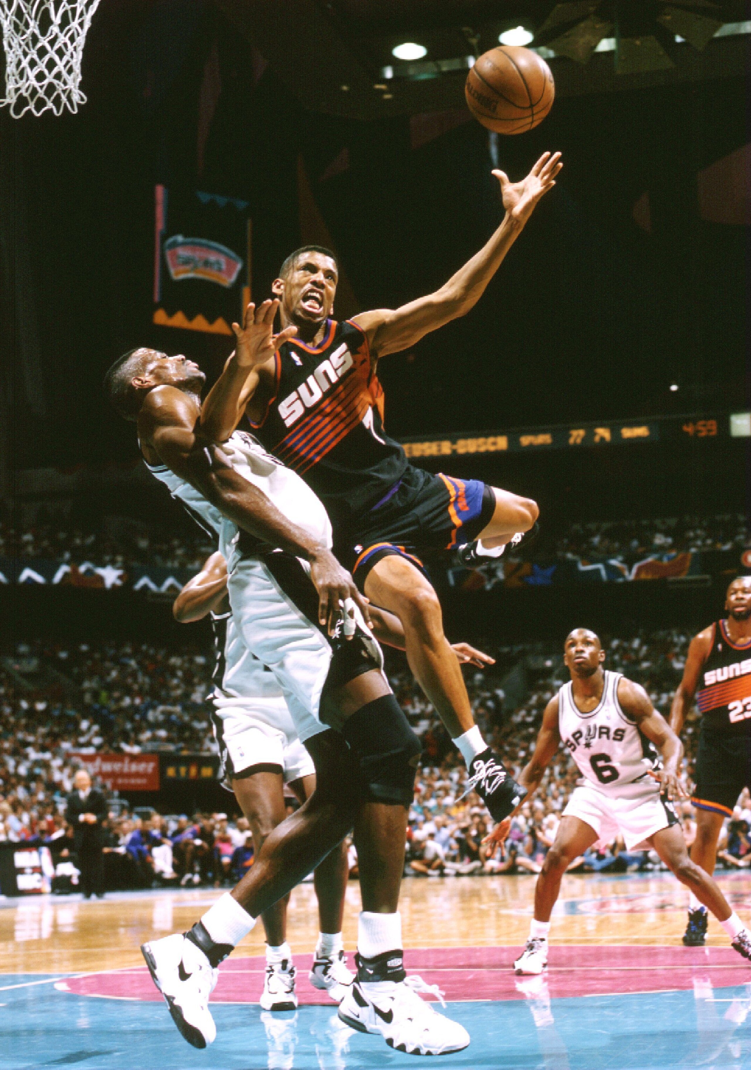 1 Feb 1997:  Center Tim Duncan of the Wake Forest Demon Deacons (left) looks on with teammate guard Jerry Braswell during a game against the Maryland Terrapins at the Cole Field House in College Park, Maryland.  Wake Forest won the game, 74-69. Mandatory
