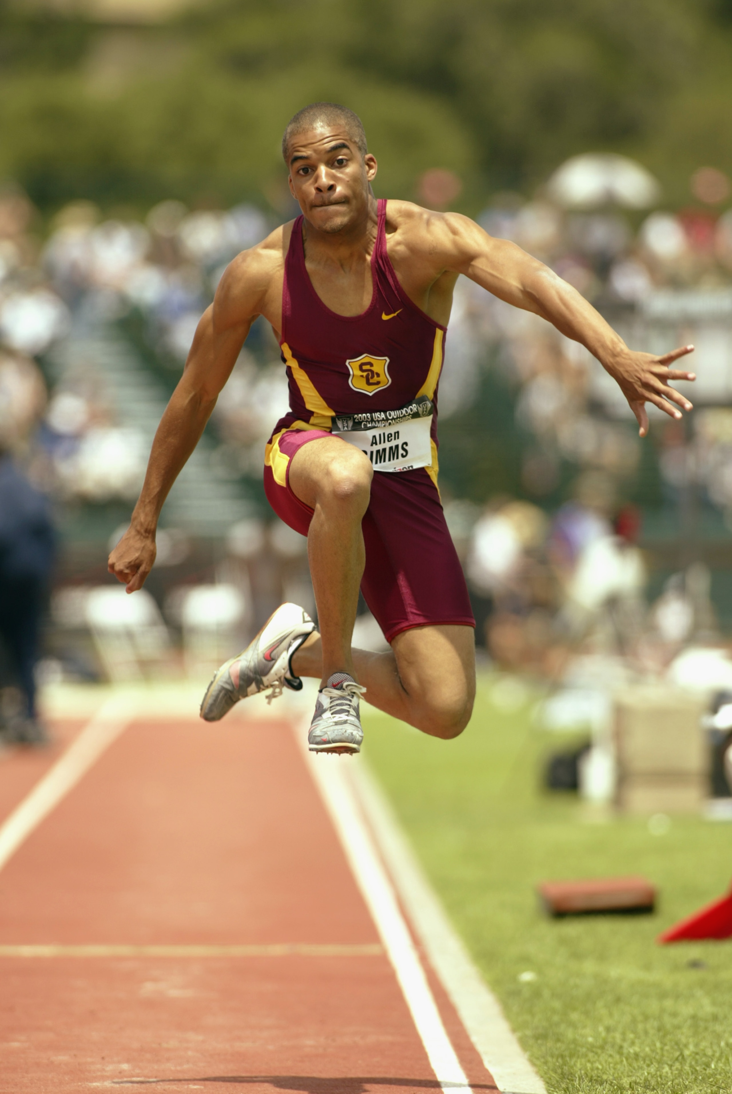 PALO ALTO, CA - JUNE 22: Allen Simms of the University of Southern California competes in the men's triple jump during the USA Outdoor Track and Field Championships on June 22, 2003 at Cobb Track and Angell Field at Stanford University in Palo Alto, Cali PALO ALTO, CA - JUNE 22: Allen Simms of the University of Southern California competes in the men's triple jump during the USA Outdoor Track and Field Championships on June 22, 2003 at Cobb Track and Angell Field at Stanford University in Palo Alto, Cali