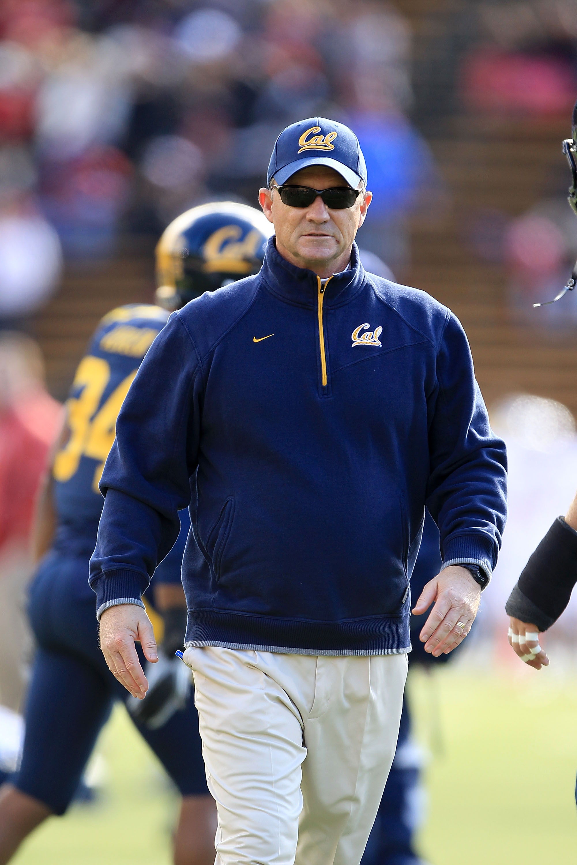 BERKELEY, CA - NOVEMBER 20:  Head coach Jeff Tedford of the California Golden Bears watches his team warm up before their game against the Stanford Cardinal at California Memorial Stadium on November 20, 2010 in Berkeley, California.  (Photo by Ezra Shaw/