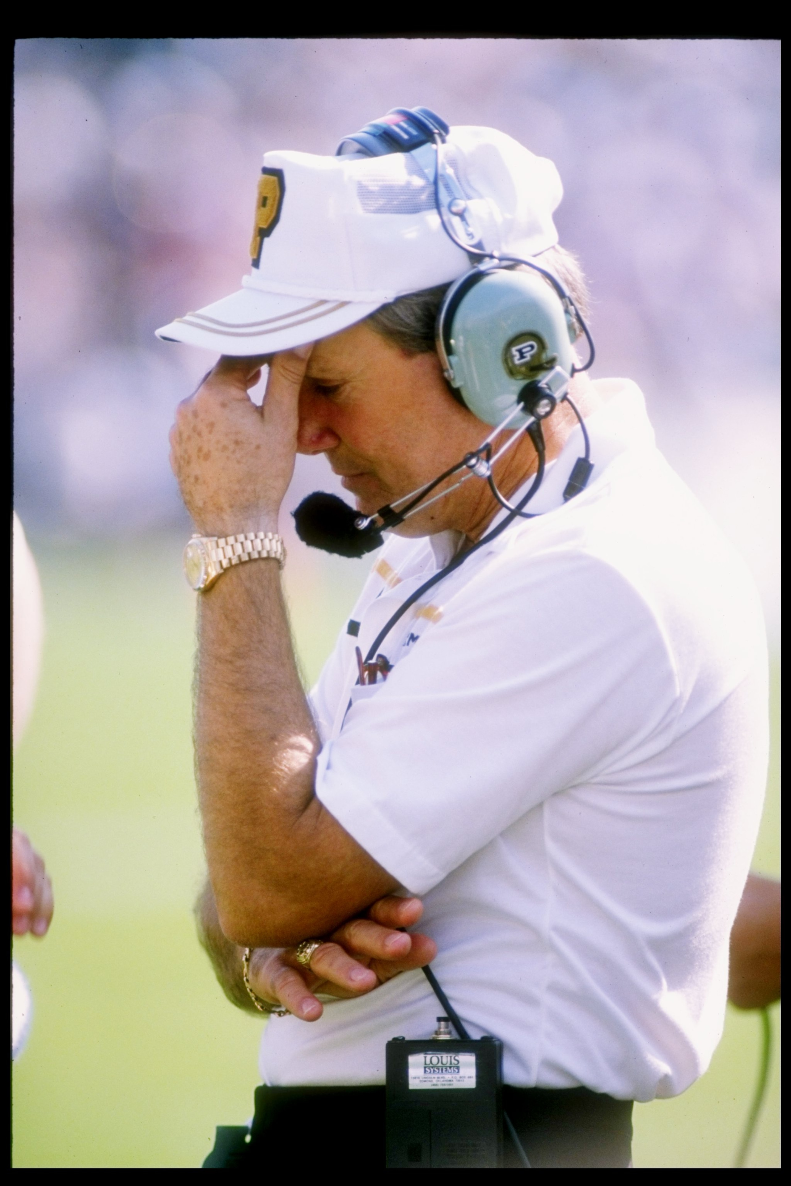 30 Sep 1989: Coach Fred Akers of the Purdue Boilermakers holds his head during a game against the Notre Dame Fighting Irish at Ross Ade Stadium in West Lafayette, Indiana . Notre Dame won the game 40-7.