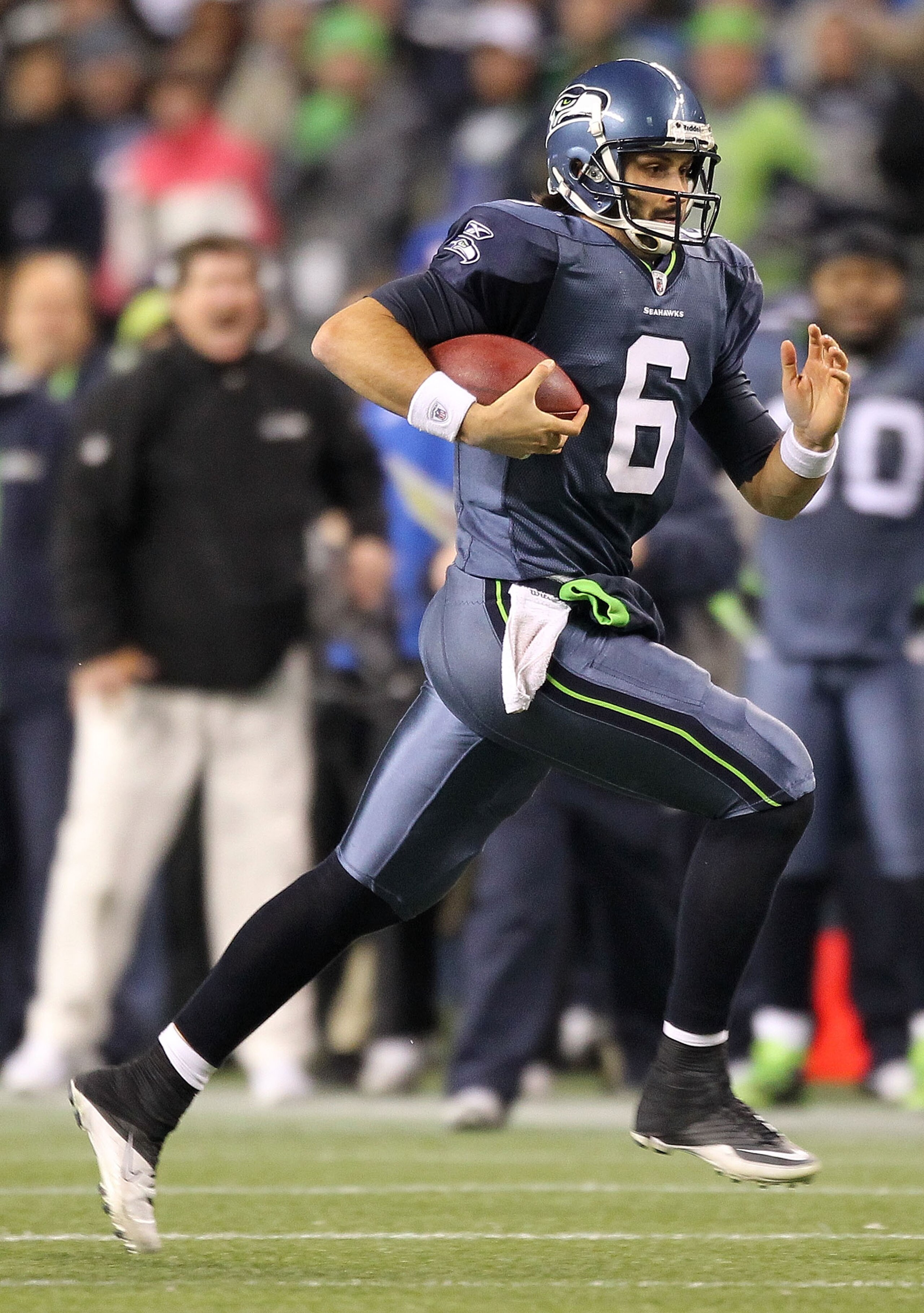 SEATTLE, WA - JANUARY 02:  Quarterback Charlie Whitehurst #6 of the Seattle Seahawks runs with the ball during their game against the St. Louis Rams at Qwest Field on January 2, 2011 in Seattle, Washington.  (Photo by Otto Greule Jr/Getty Images)