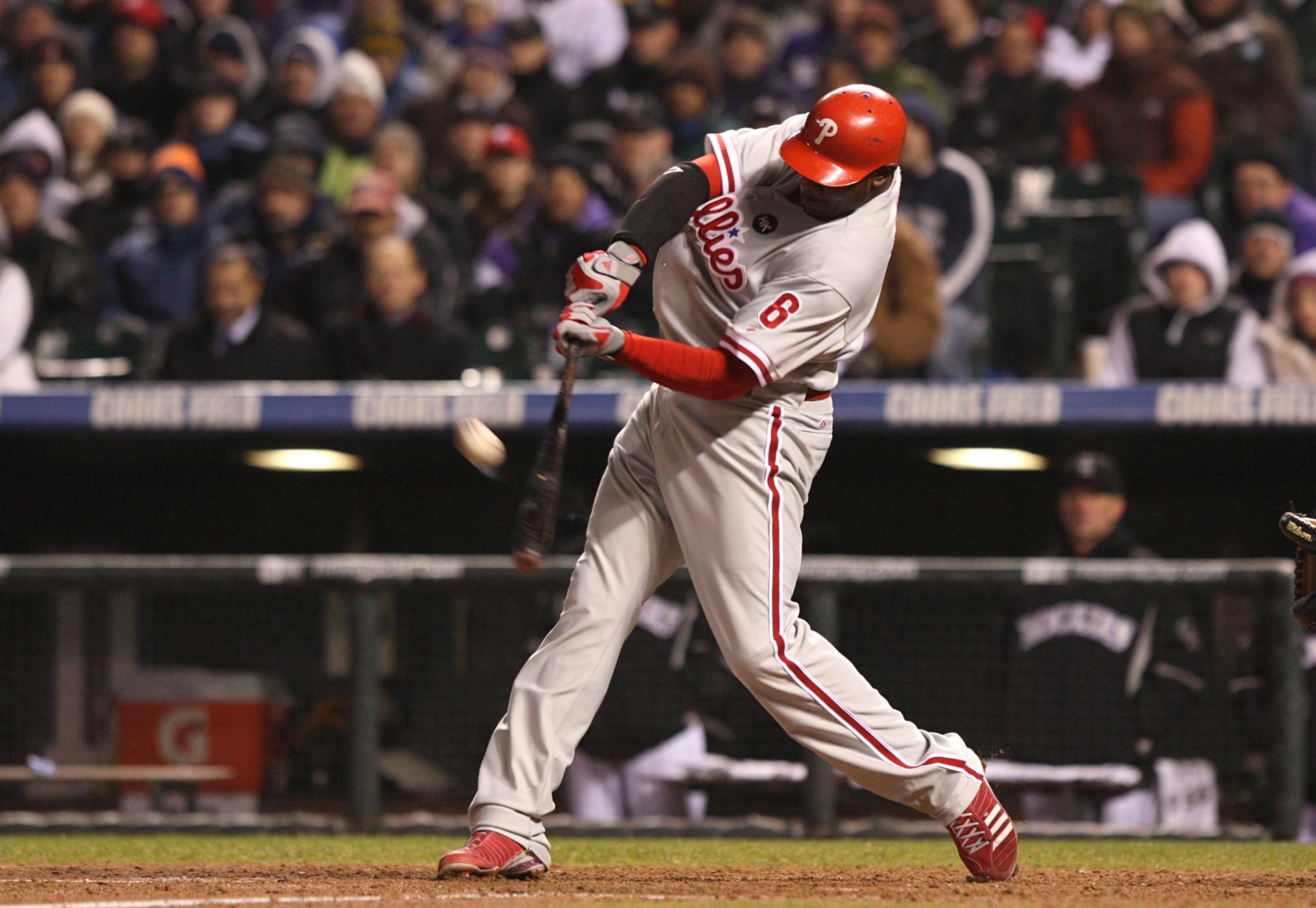 DENVER - OCTOBER 11:  Ryan Howard #6 of the Philadelphia Phillies hits a go ahead RBI sacrifice fly against the Colorado Rockies in the top of the ninth inning to give the Phillies a 6-5 lead in Game Three of the NLDS during the 2009 MLB Playoffs at Coors