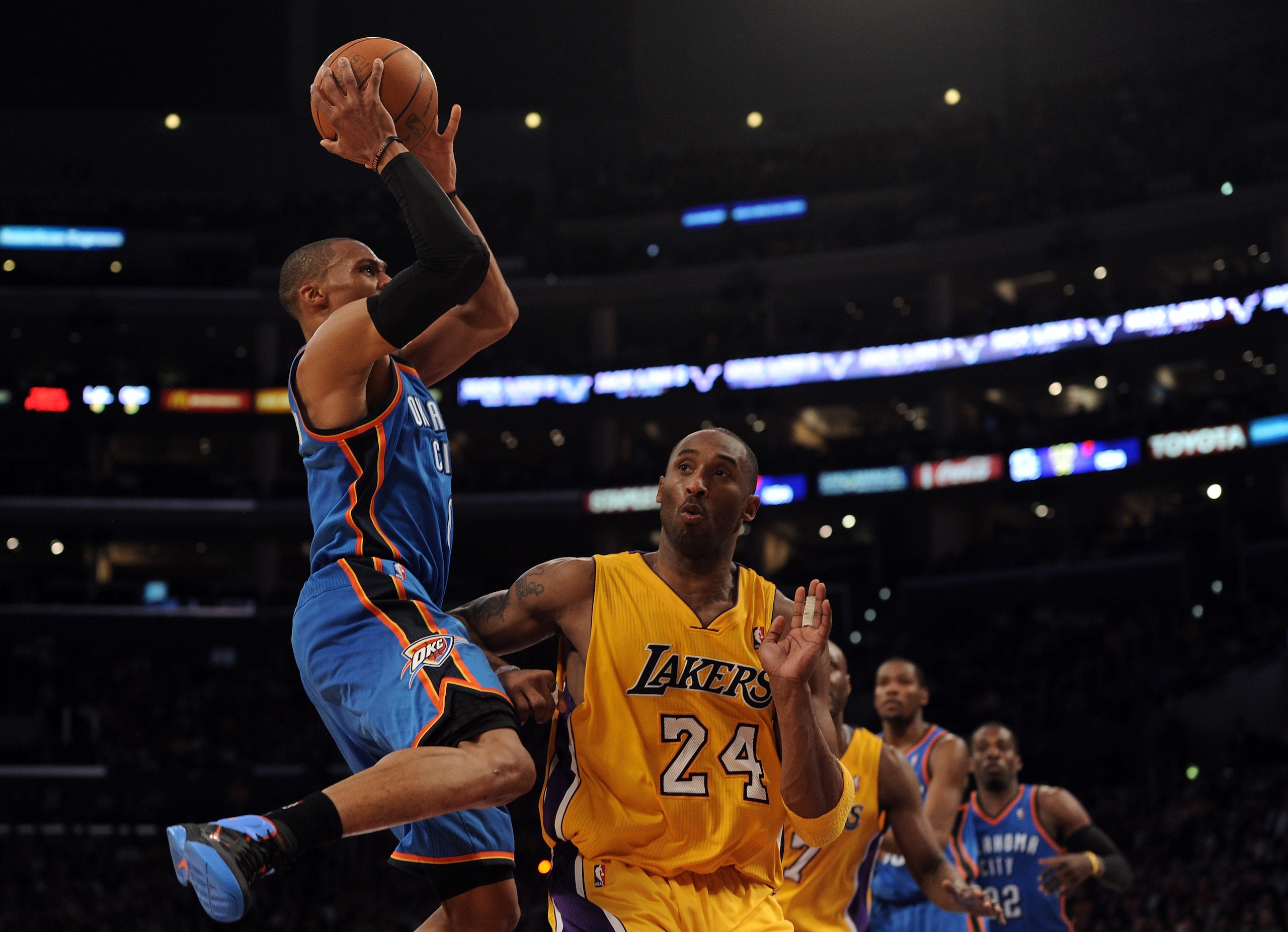 LOS ANGELES, CA - JANUARY 17:   Russell Westbrook #0 of the Oklahoma City Thunder shoots a jumper over Kobe Bryant #24 of the Los Angeles Lakers during a 101-94 Laker win at the Staples Center on January 17, 2011 in Los Angeles, California.   NOTE TO USER