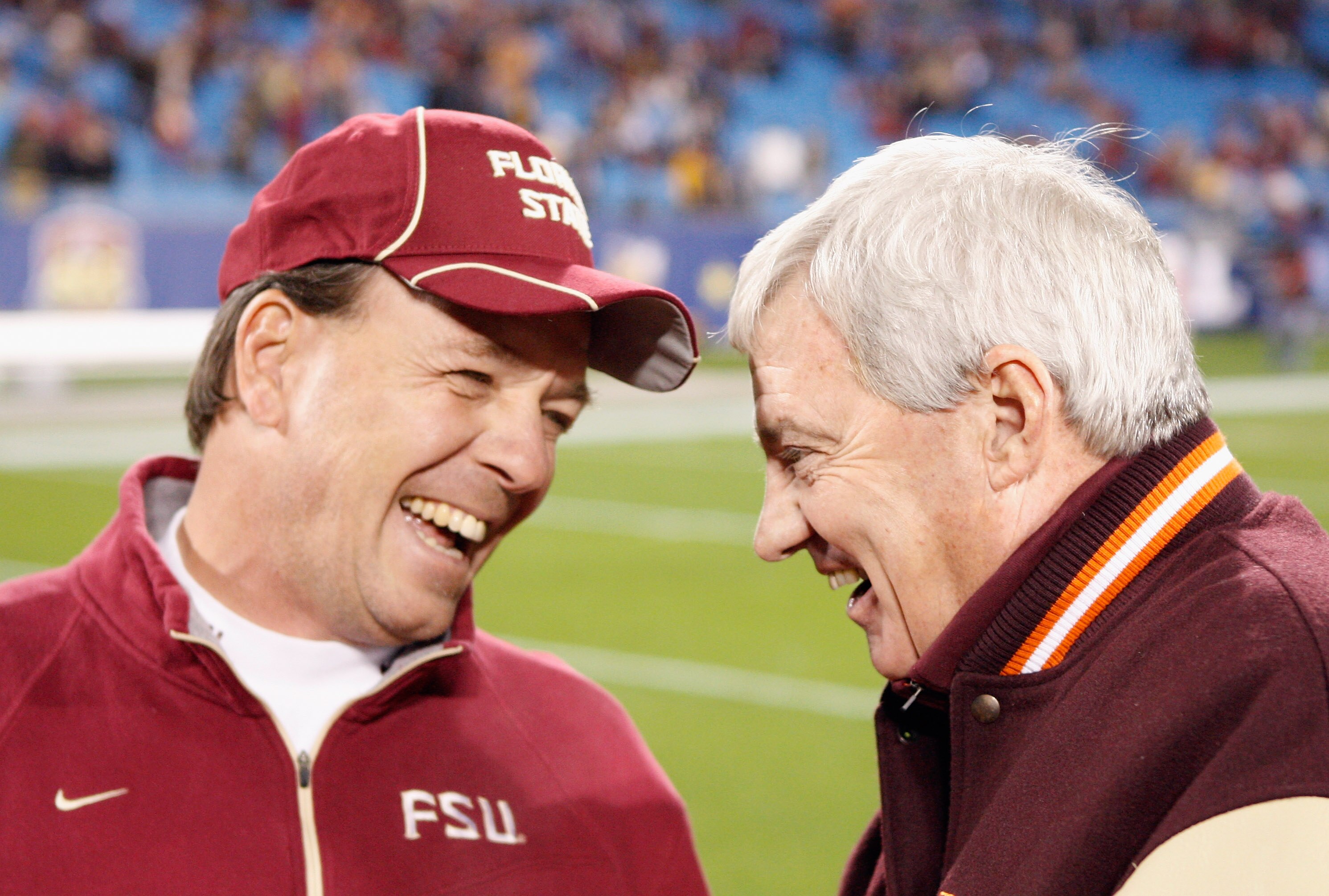 CHARLOTTE, NC - DECEMBER 04:  Head coach Jimbo Fisher of the Florida State Seminoles talks with head coach Frank Beamer of the Virginia Tech Hokies during their game at Bank of America Stadium on December 4, 2010 in Charlotte, North Carolina.  (Photo by S