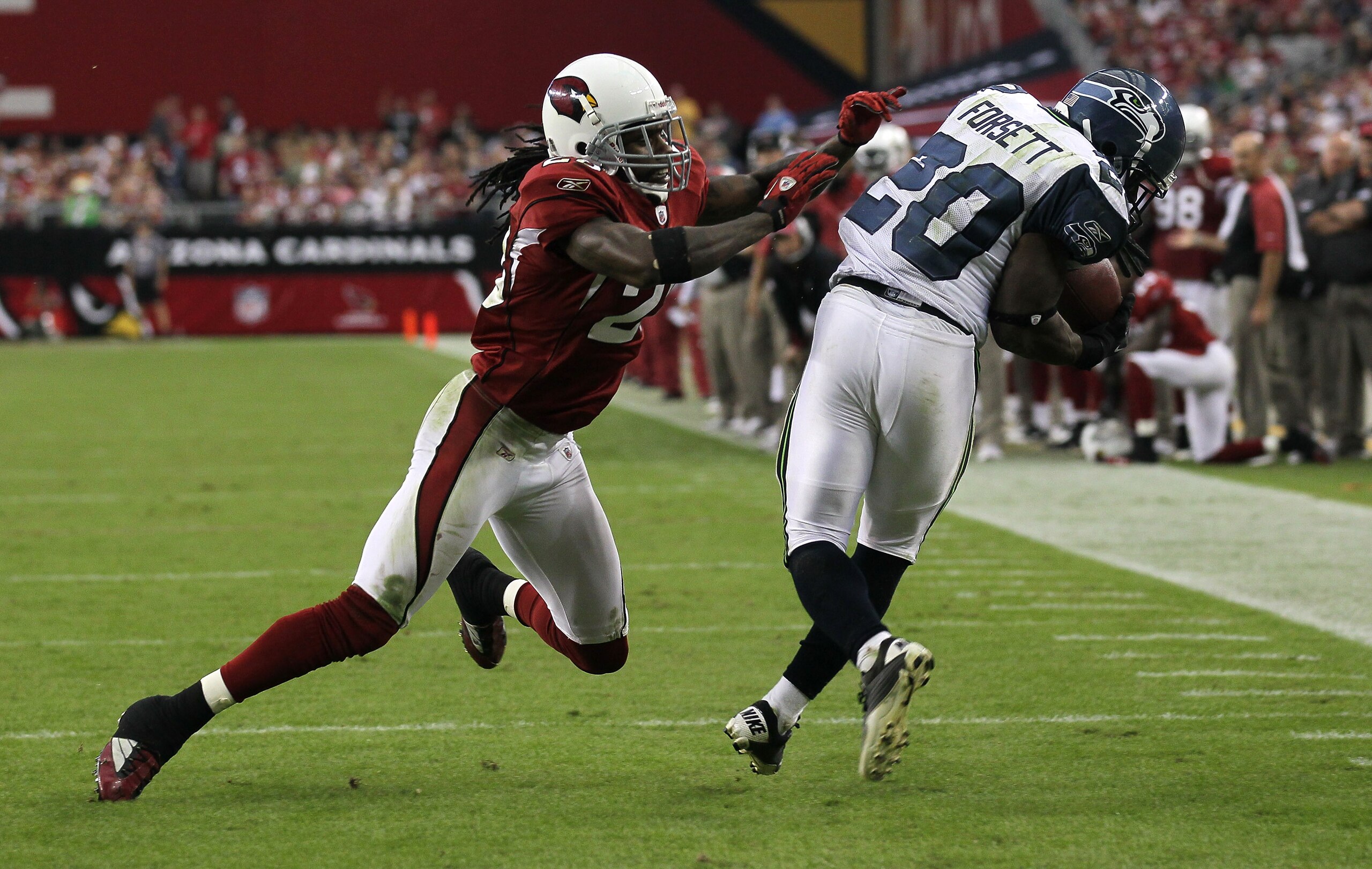 GLENDALE, AZ - NOVEMBER 14: Cornerback Greg Toler #28 of the Arizona Cardinals knocks down running back Justin Forsett #20 of the Seattle Seahawks after a pass reception at University of Phoenix Stadium on November 14, 2010 in Glendale, Arizona. Seattle GLENDALE, AZ - NOVEMBER 14: Cornerback Greg Toler #28 of the Arizona Cardinals knocks down running back Justin Forsett #20 of the Seattle Seahawks after a pass reception at University of Phoenix Stadium on November 14, 2010 in Glendale, Arizona. Seattle