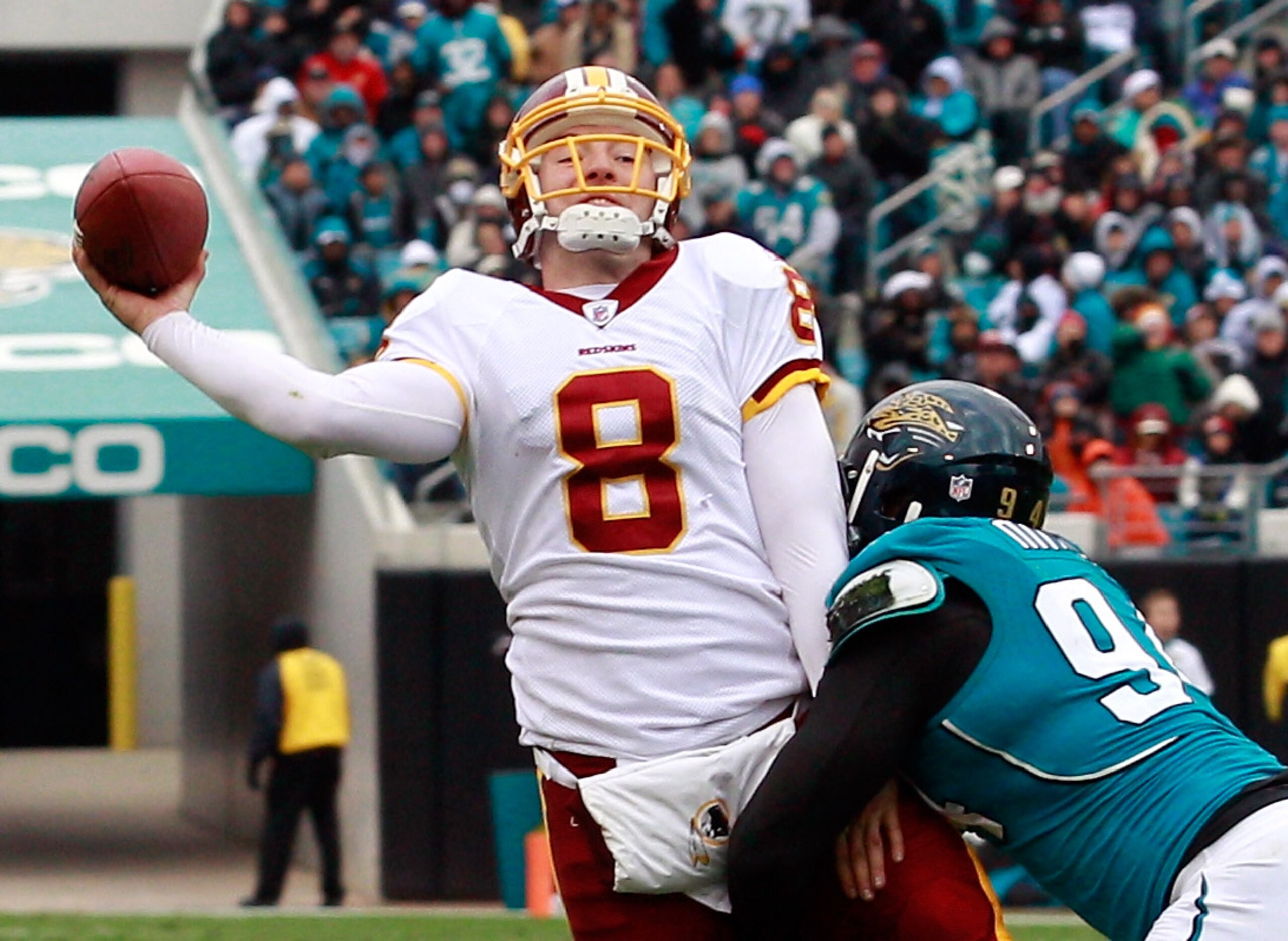 JACKSONVILLE, FL - DECEMBER 26:  Quarterback Rex Grossman #8 of the Washington Redskins is pressured by Jeremy Mincey #94 of the Jacksonville Jaguars during the game at EverBank Field on December 26, 2010 in Jacksonville, Florida.  (Photo by Sam Greenwood
