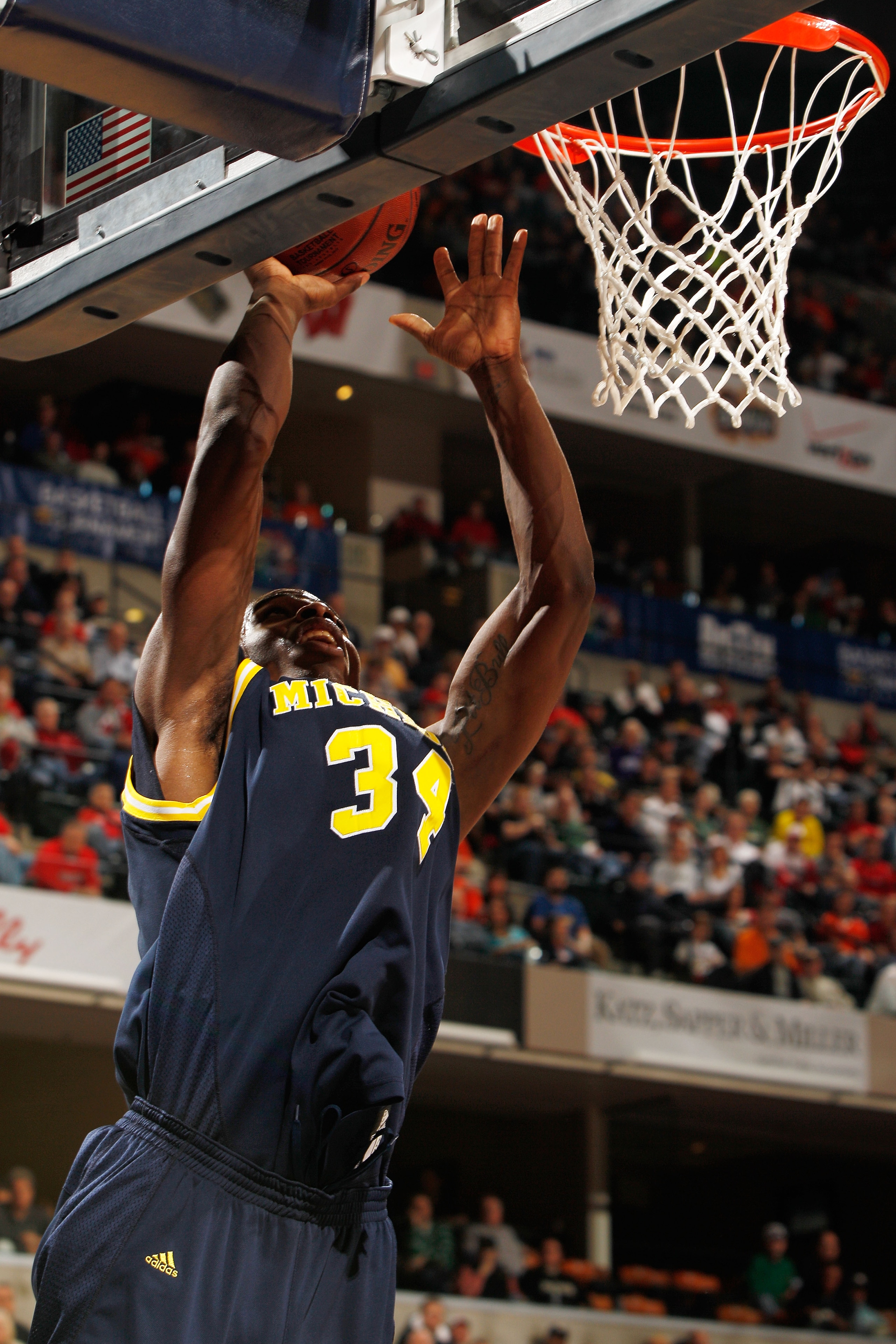 INDIANAPOLIS - MARCH 12: Forward DeShawn Sims #34 of the Michigan Wolverines attempts a shot against the Ohio State Buckeyes during the quarterfinals of the Big Ten Men's Basketball Tournament at Conseco Fieldhouse on March 12, 2010 in Indianapolis, Indi INDIANAPOLIS - MARCH 12: Forward DeShawn Sims #34 of the Michigan Wolverines attempts a shot against the Ohio State Buckeyes during the quarterfinals of the Big Ten Men's Basketball Tournament at Conseco Fieldhouse on March 12, 2010 in Indianapolis, Indi