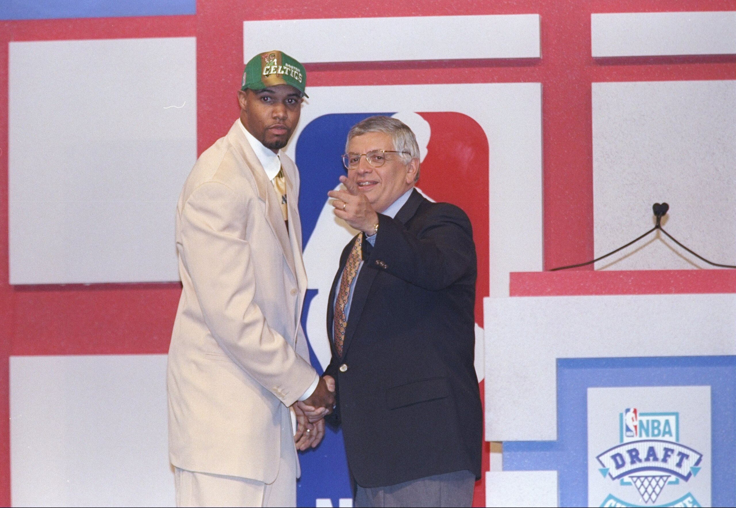 25 Jun 1997:  Forward Ron Mercer of the Boston Celtics shakes hands with NBA Commissioner David Stern during the NBA Draft at the Charlotte Coliseum in Charlotte, North Carolina. Mandatory Credit: Craig Jones  /Allsport