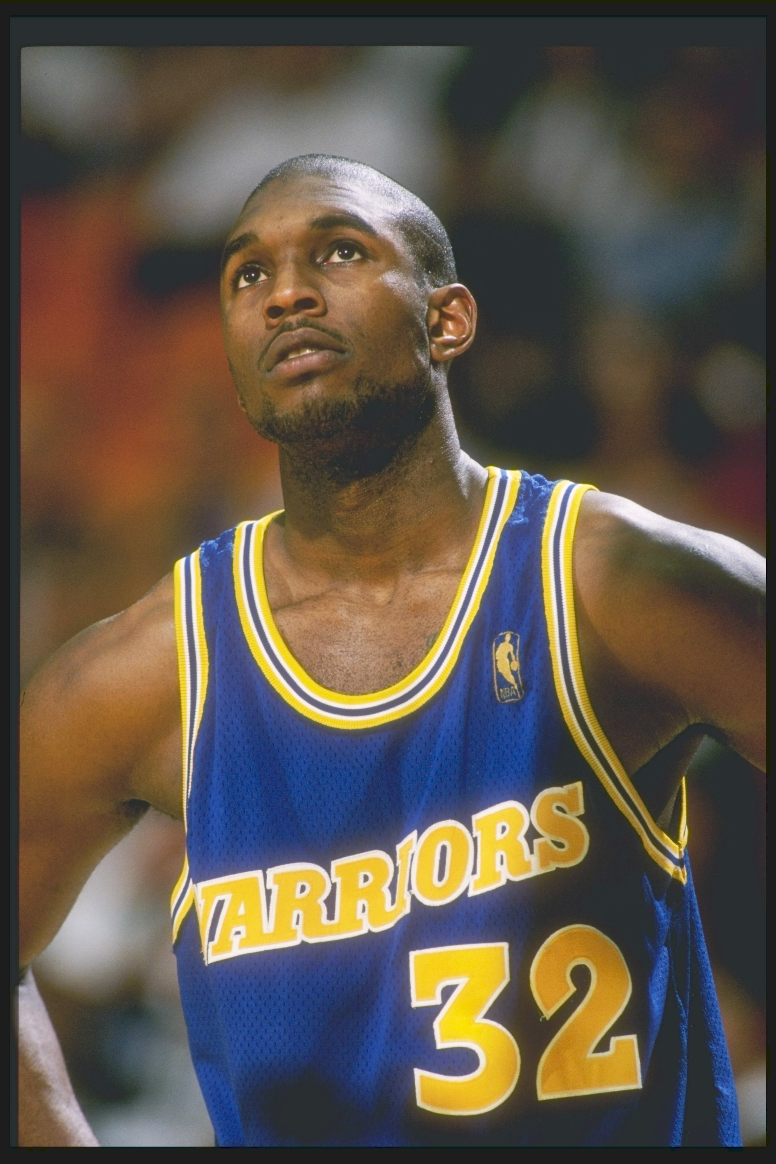 12 Mar 1997: Forward Joe Smith of the Golden State Warriors stands on the court during a game against the Los Angeles Lakers at the Great Western Forum in Inglewood, California. The Lakers won the game 109-101.