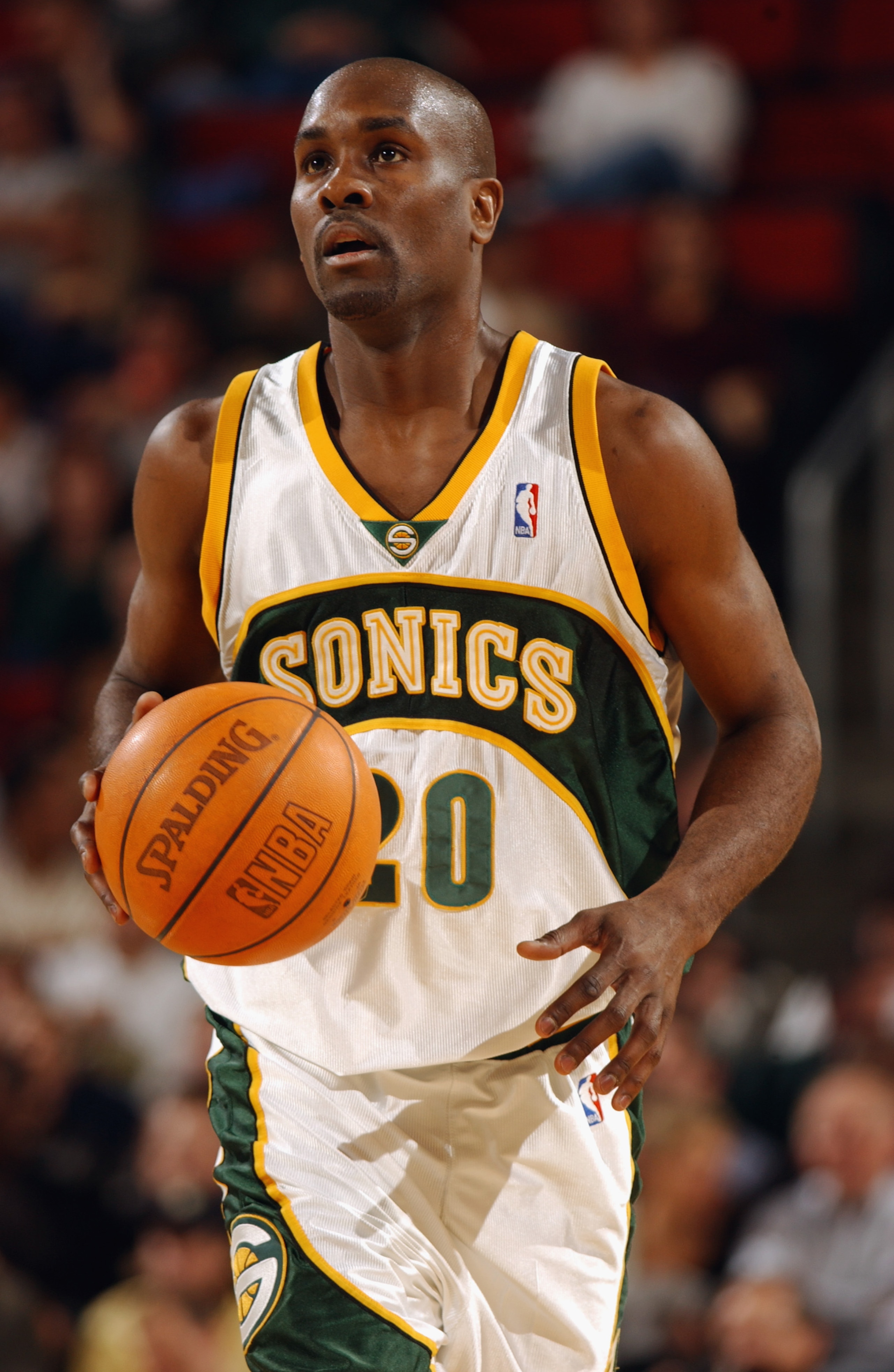 SEATTLE - OCTOBER 30:  Gary Payton #20 of the Seattle Sonics moves the ball upcourt during the game against the Phoenix Suns at Key Arena on October 30, 2002 in Seattle, Washington.  The Sonics won 86-73.  NOTE TO USER: User expressly acknowledges and agr