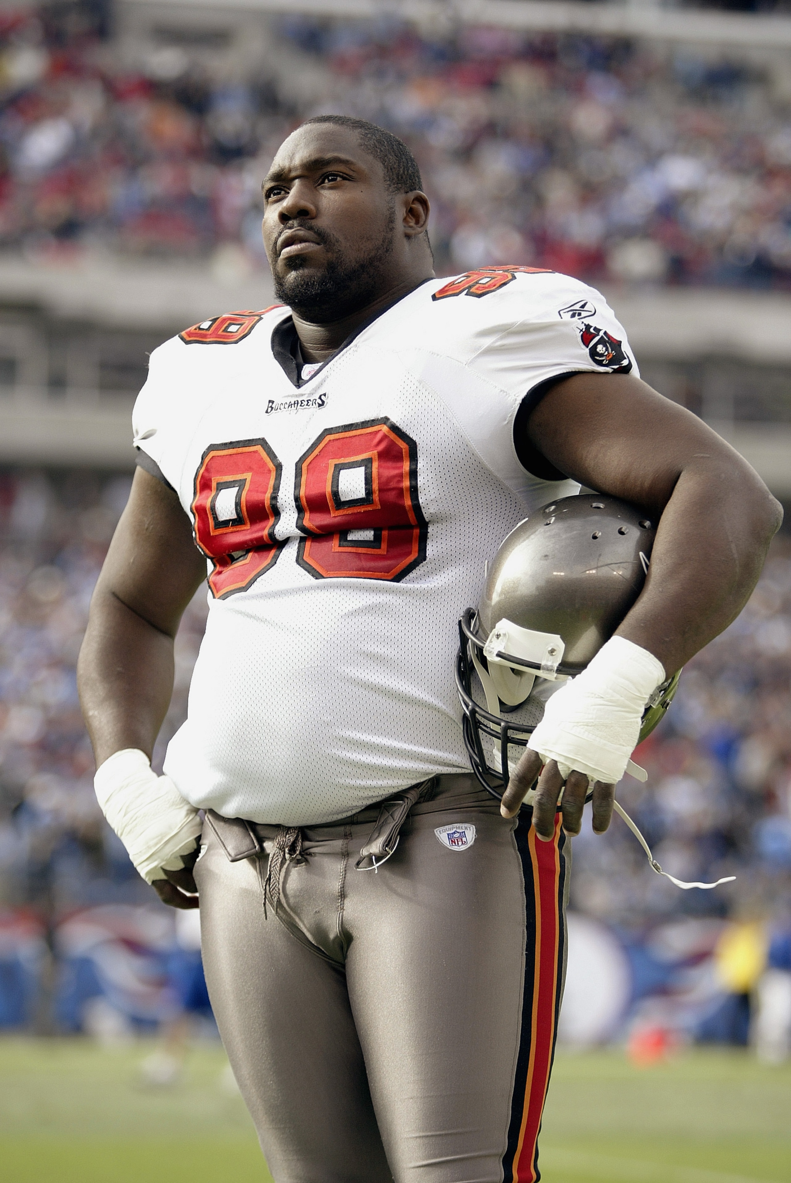 NASHVILLE, TN - DECEMBER 28:  Defensive tackle Warren Sapp #99 of the Tampa Bay Buccaneers watches the game against the Tennessee Titans on December 28, 2003 at The Coliseum in Nashville, Tennessee. The Titans defeated the Buccaneers 33-13. (Photo by Elsa