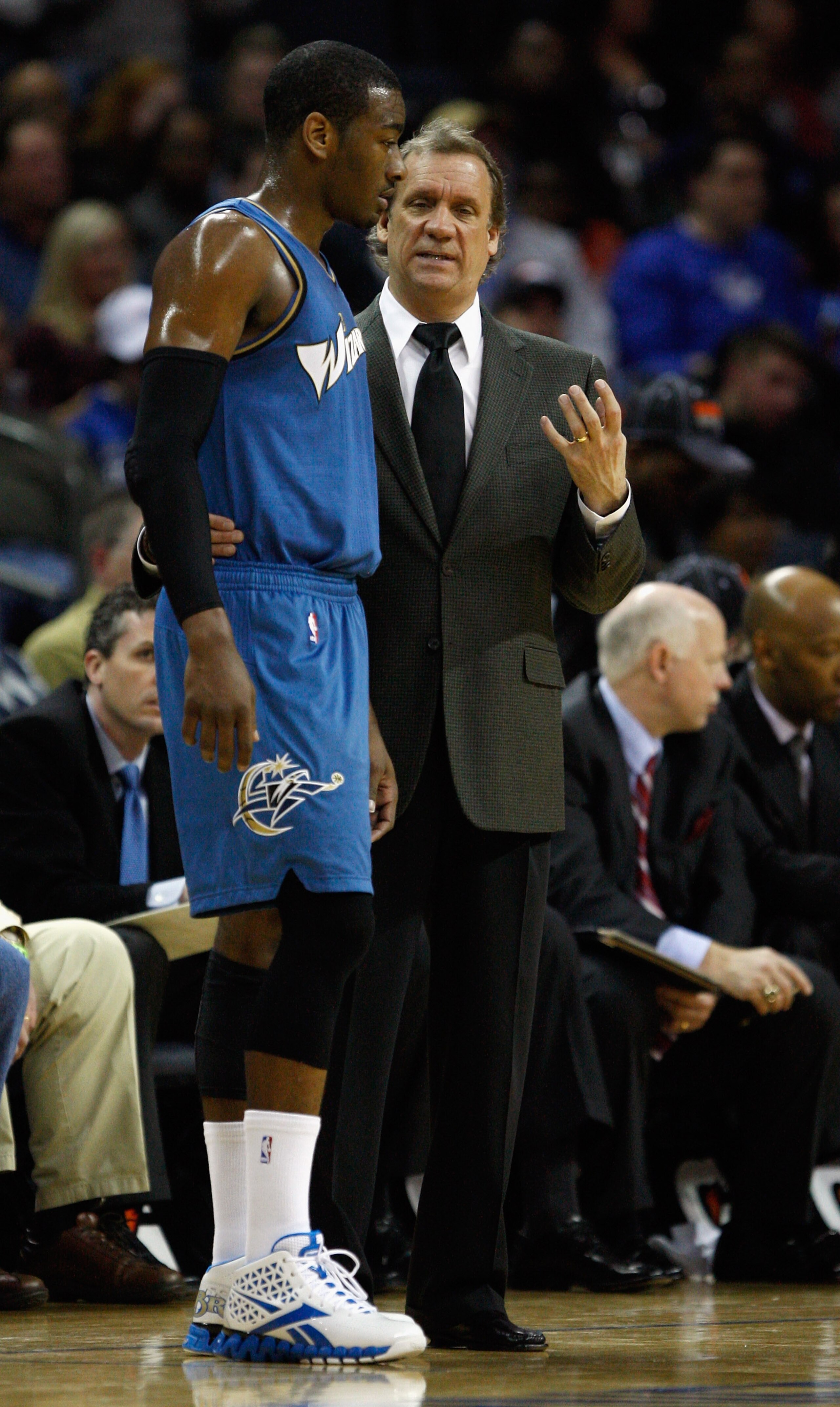 CHARLOTTE, NC - JANUARY 08:  Head coach Flip Saunders and John Wall #2 of the Washington Wizards talk on the sidelines during their game agains the Charlotte Bobcats at Time Warner Cable Arena on January 8, 2011 in Charlotte, North Carolina. NOTE TO USER: