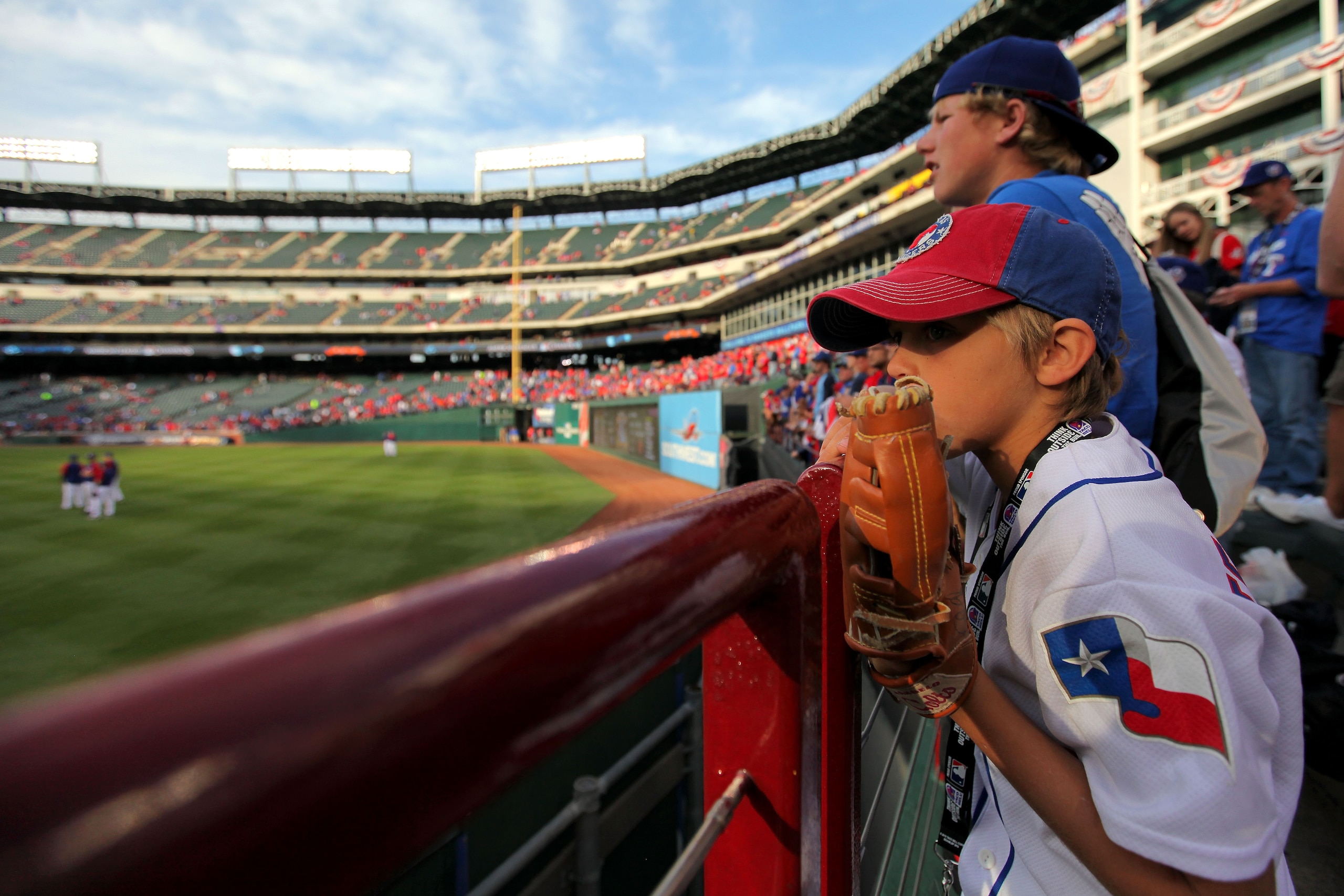 ARLINGTON, TX - NOVEMBER 01:  Fans of the Texas Rangers watch batting practice against the San Francisco Giants in Game Five of the 2010 MLB World Series at Rangers Ballpark in Arlington on November 1, 2010 in Arlington, Texas.  (Photo by Doug Pensinger/G
