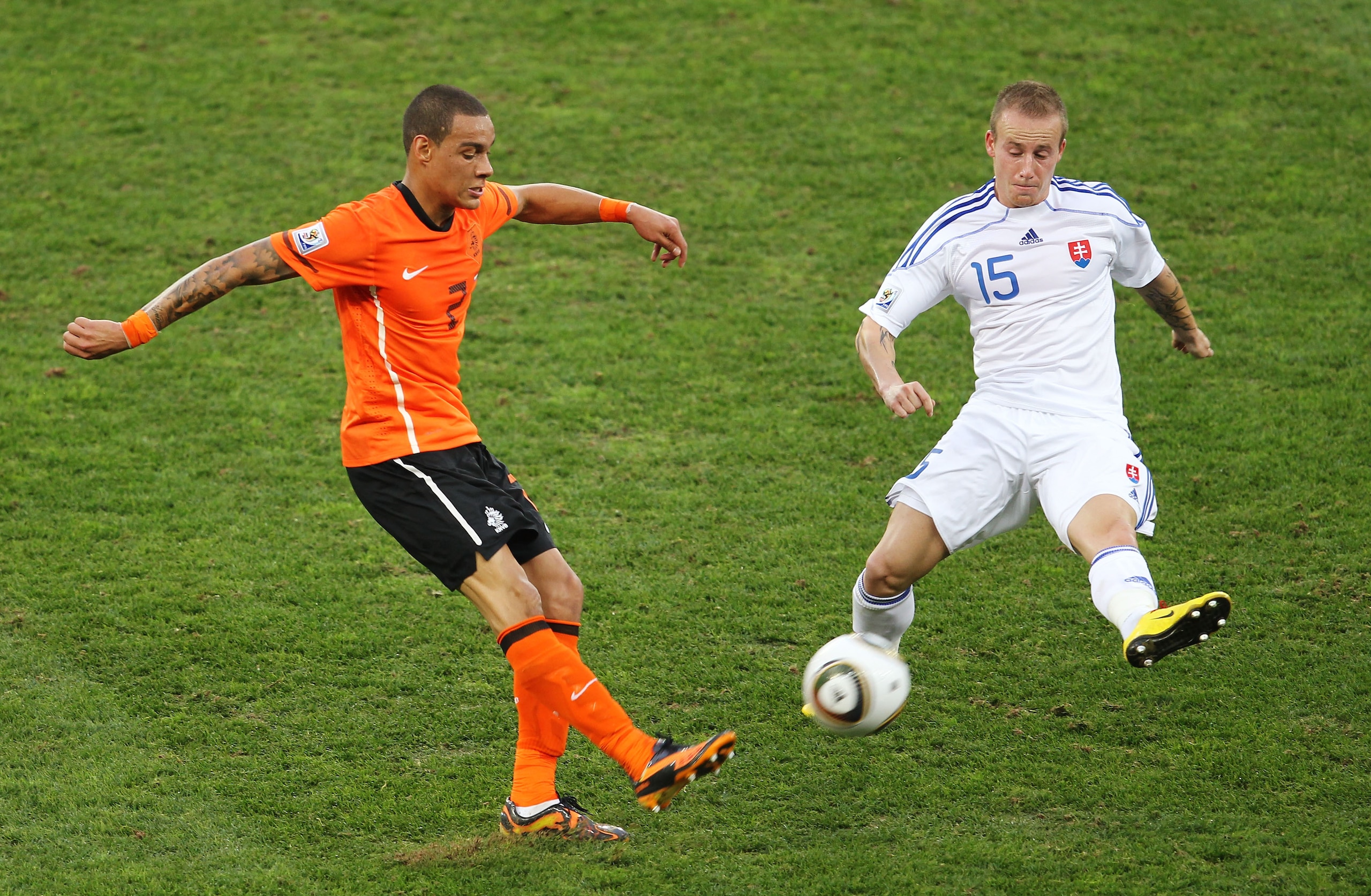 DURBAN, SOUTH AFRICA - JUNE 28:  Gregory Van Der Wiel of the Netherlands and Miroslav Stoch of Slovakia in action during the 2010 FIFA World Cup South Africa Round of Sixteen match between Netherlands and Slovakia at Durban Stadium on June 28, 2010 in Dur