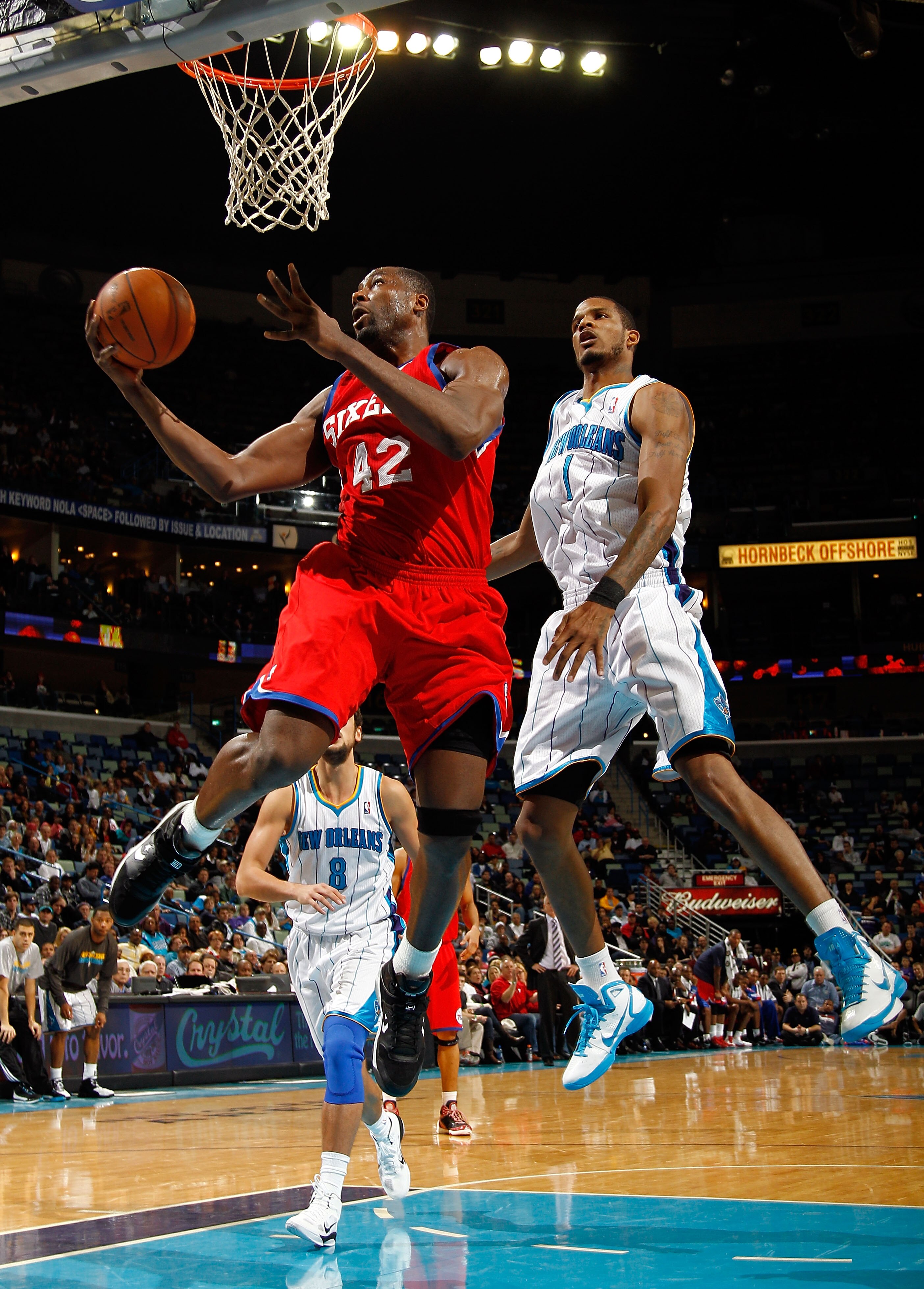 NEW ORLEANS, LA - JANUARY 03:  Elton Brand #42 of the Philadelphia 76ers goes up for a shot in front of Trevor Ariza #1 of the New Orleans Hornets in the second half at New Orleans Arena on January 3, 2011 in New Orleans, Louisiana. NOTE TO USER: User exp