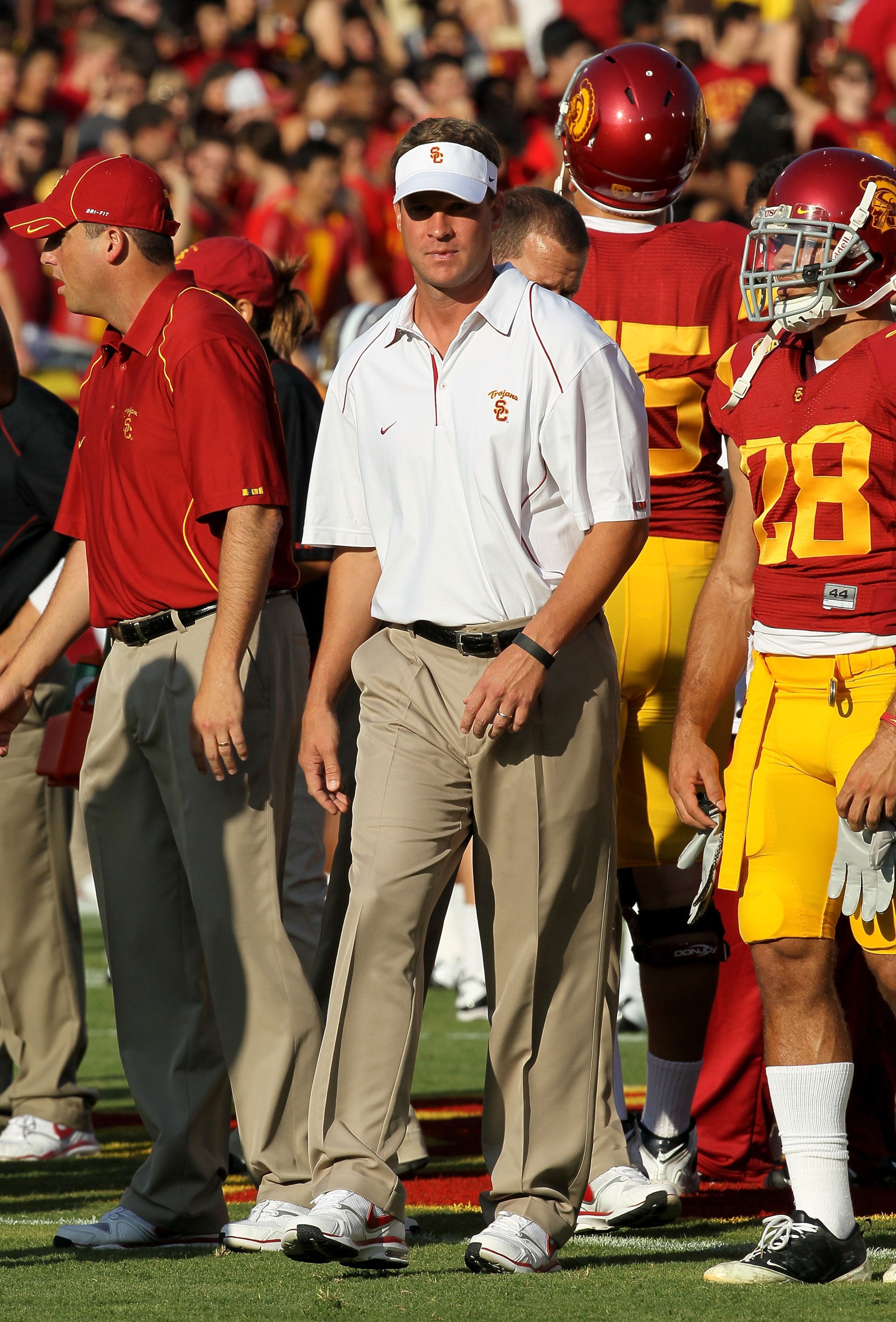 LOS ANGELES, CA - OCTOBER 02:  Head coach Lane Kiffin of the USC Trojans watches pregame warmups before the game with the Washington Huskies at the Los Angeles Memorial Coliseum on October 2, 2010 in Los Angeles, California.  (Photo by Stephen Dunn/Getty