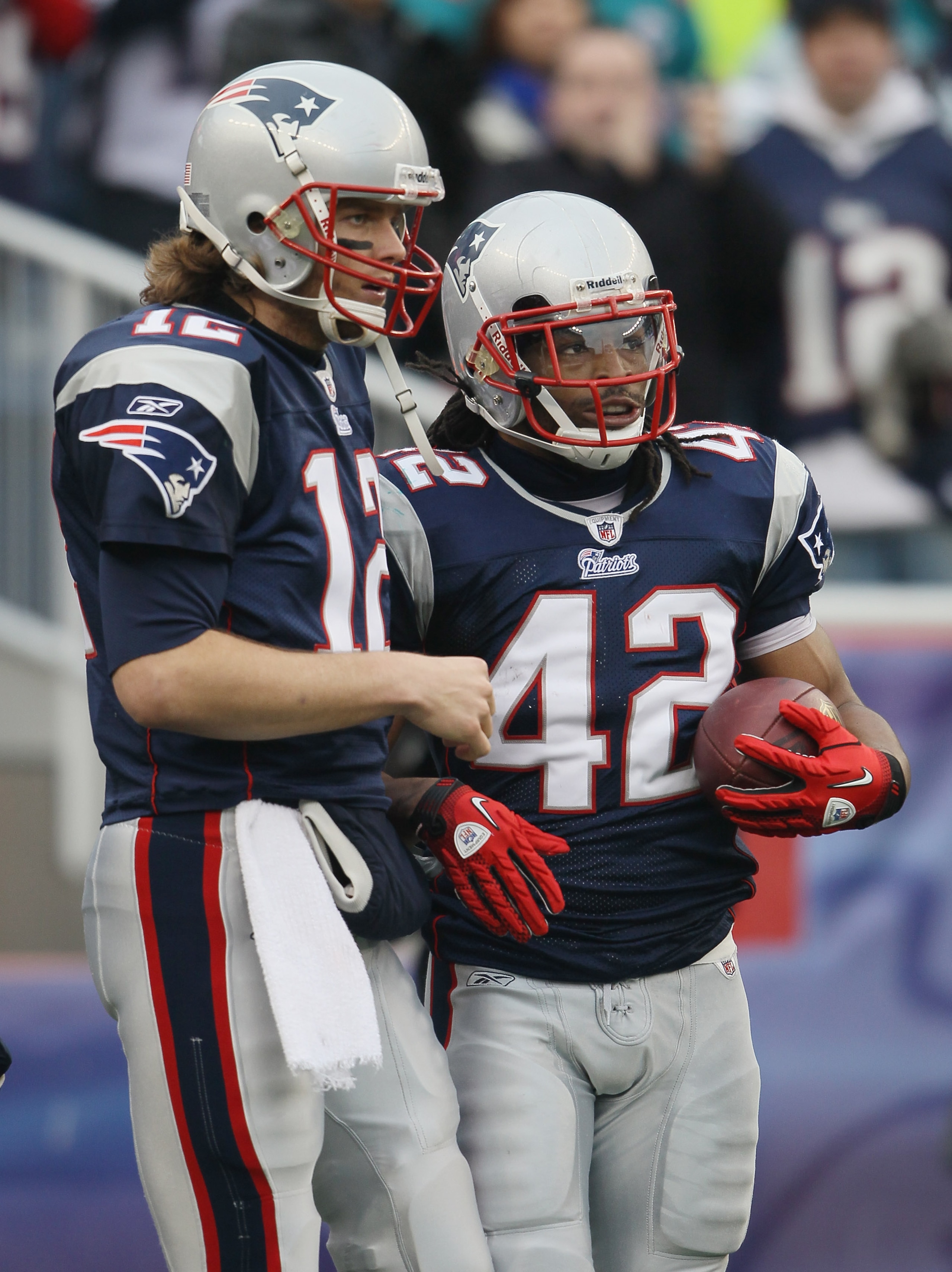 FOXBORO, MA - JANUARY 02:  Tom Brady #12 of the New England Patriots and BenJarvus Green-Ellis #42 celebrate the touchdown in the first half against the Miami Dolphins on January 2, 2011 at Gillette Stadium in Foxboro, Massachusetts.  (Photo by Elsa/Getty