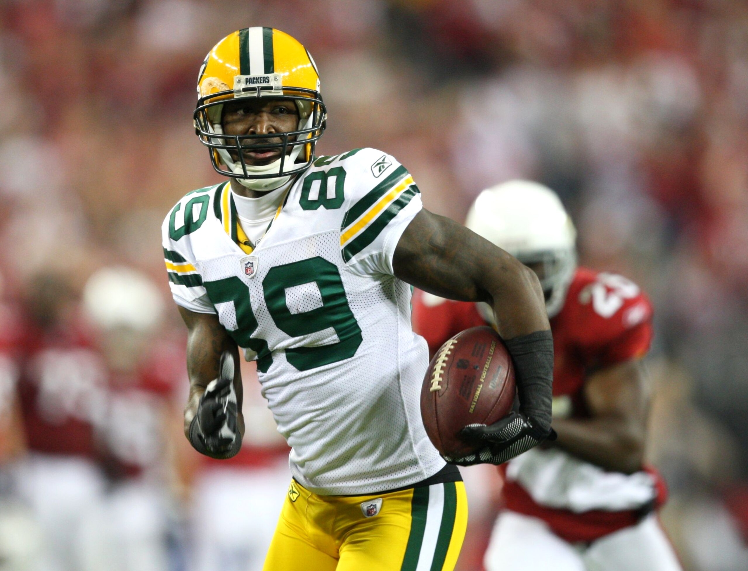 GLENDALE, AZ - JANUARY 10:  James Jones #89 of the Green Bay Packers scores a touchdown against the Arizona Cardinals during the fourth quarter of the 2010 NFC wild-card playoff game at University of Phoenix Stadium on January 10, 2010 in Glendale, Arizon