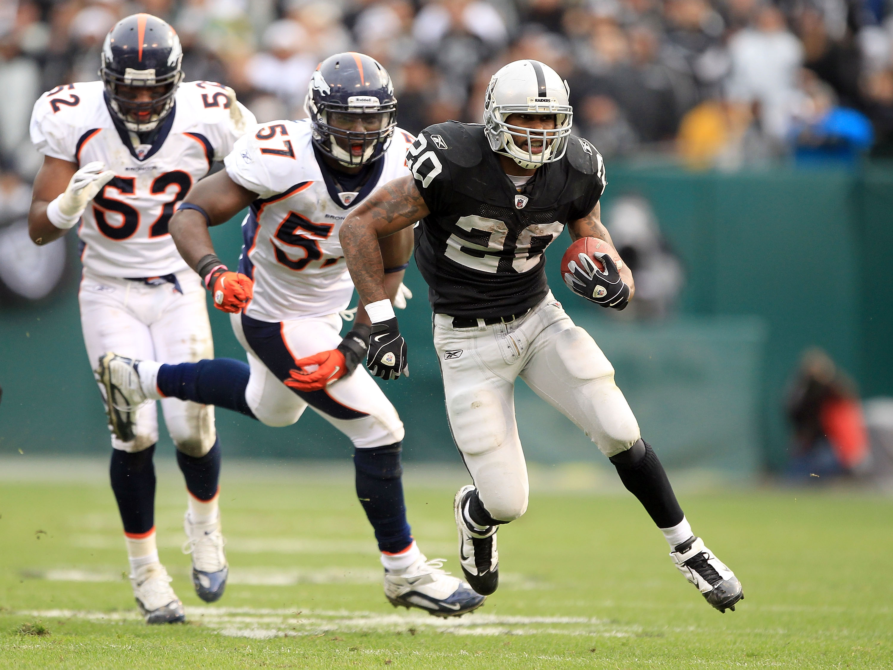 OAKLAND, CA - DECEMBER 19: Darren McFadden #20 of the Oakland Raiders runs with the ball during their game against the Denver Broncos at Oakland-Alameda County Coliseum on December 19, 2010 in Oakland, California. (Photo by Ezra Shaw/Getty Images) OAKLAND, CA - DECEMBER 19: Darren McFadden #20 of the Oakland Raiders runs with the ball during their game against the Denver Broncos at Oakland-Alameda County Coliseum on December 19, 2010 in Oakland, California. (Photo by Ezra Shaw/Getty Images)