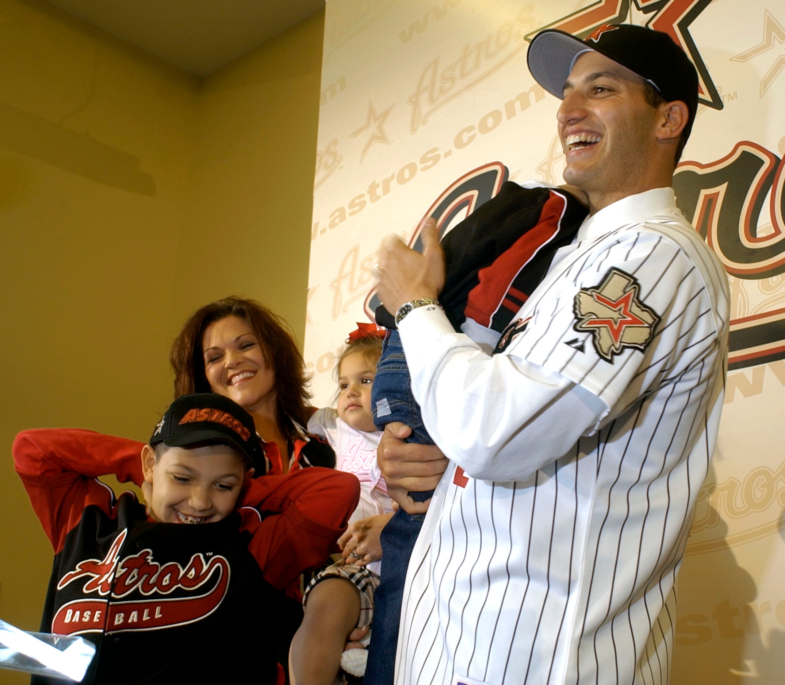 HOUSTON - DECEMBER 11: Former New York Yankees pitcher Andy Pettitte laughs as he stands with his family, from left, Joshua, 9, wife, Laura, daughter, Lexy, 2, and holding his son, Jared, 5, during a news conference announcing him as the newest member of HOUSTON - DECEMBER 11: Former New York Yankees pitcher Andy Pettitte laughs as he stands with his family, from left, Joshua, 9, wife, Laura, daughter, Lexy, 2, and holding his son, Jared, 5, during a news conference announcing him as the newest member of