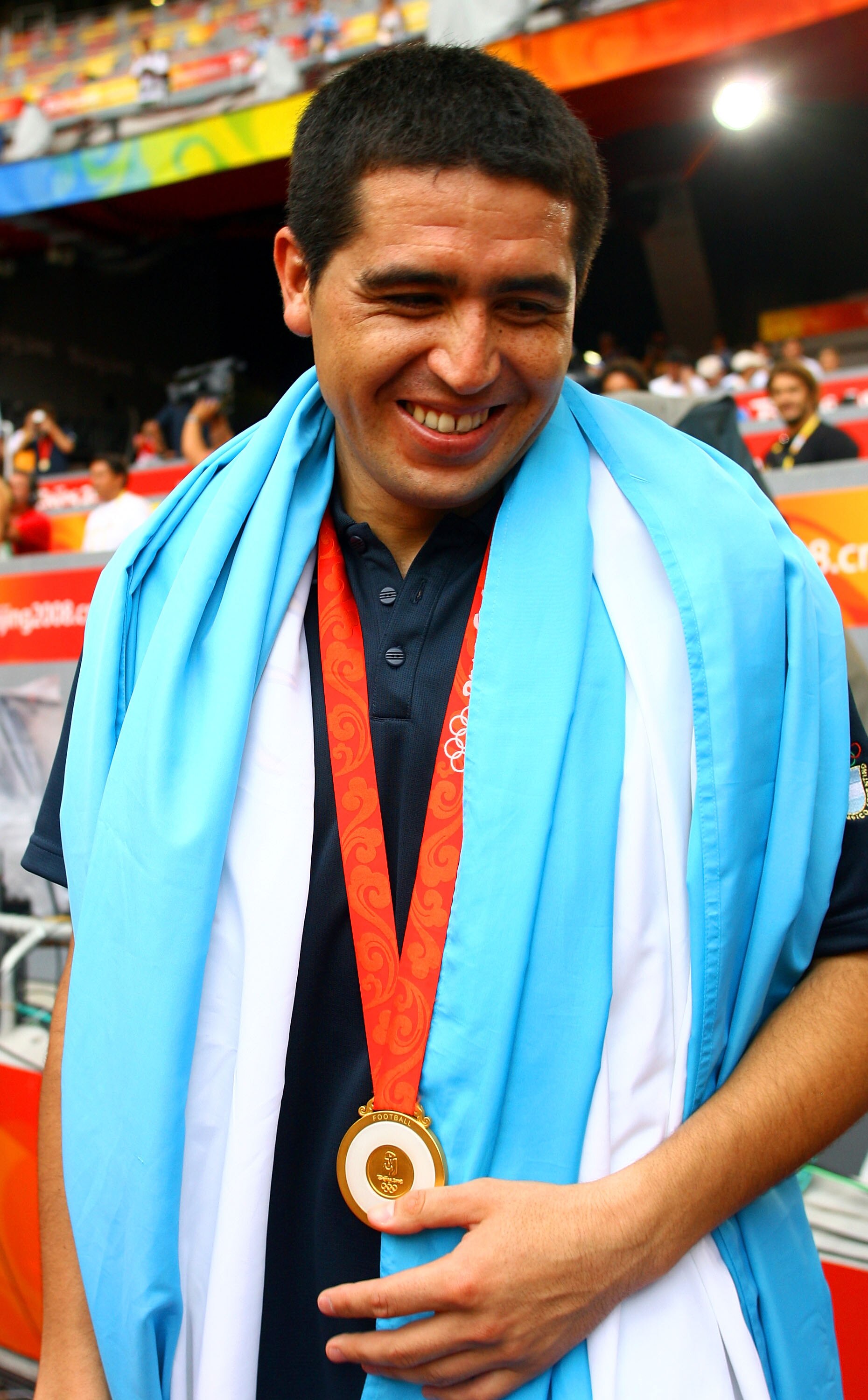 BEIJING - AUGUST 23: Argentinian Juan Roman Riquelme his national flag during the men's Olympic football tournament medal ceremony at the Men's Final between Nigeria and Argentina at the National Stadium on Day 15 of the Beijing 2008 Olympic Games on Augu
