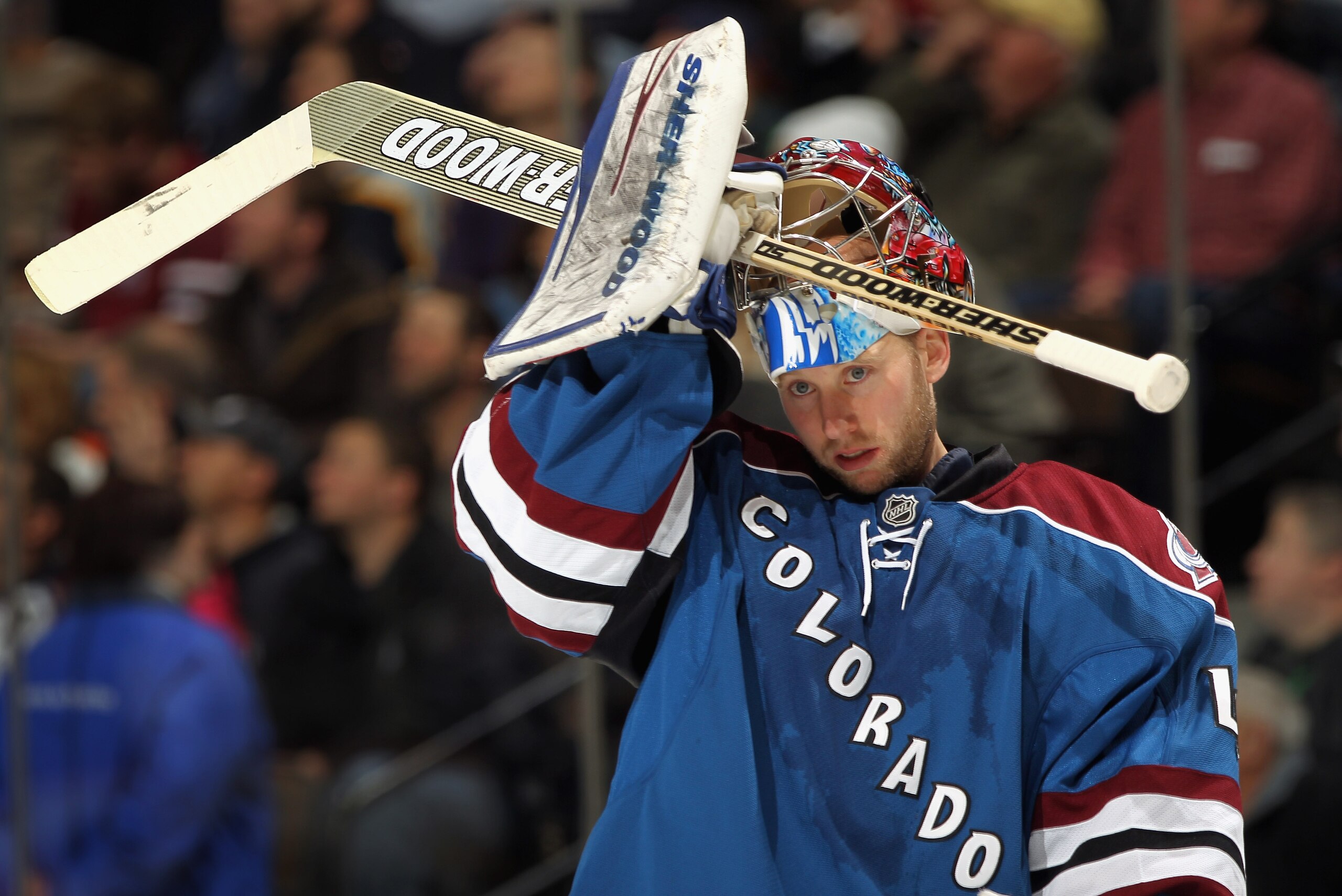 DENVER, CO - JANUARY 20:  Goalie Craig Anderson #41 of the Colorado Avalanche puts on his mask as he defends the goal against the Nashville Predators at the Pepsi Center on January 20, 2011 in Denver, Colorado.  (Photo by Doug Pensinger/Getty Images)
