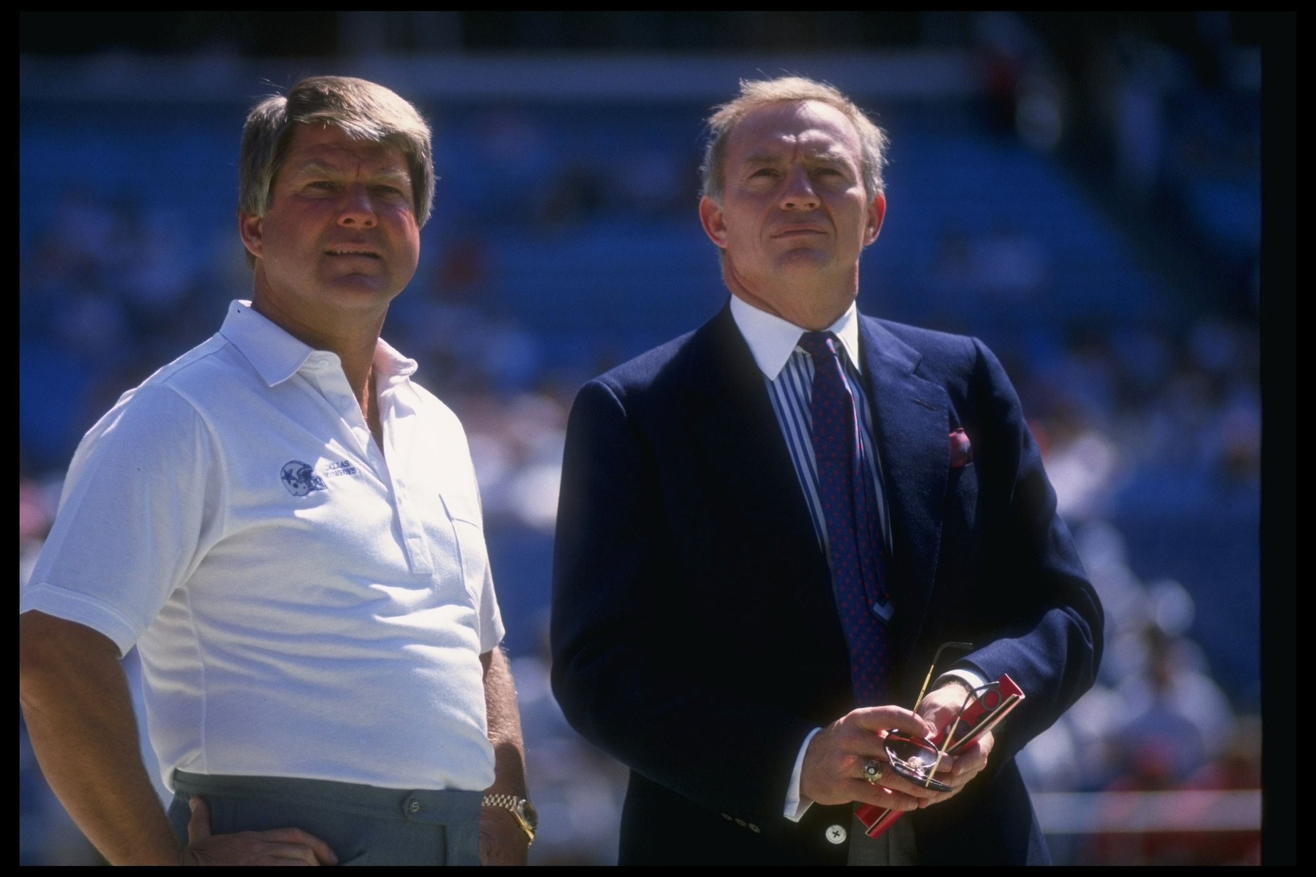 17 Sep 1989:  Dallas Cowboys head coach Jimmy Johnson (left) and owner Jerry Jones look on during a game against the Atlanta Falcons at Fulton County Stadium in Atlanta, Georgia.  The Falcons won the game, 27-21. Mandatory Credit: Allen Dean Steele  /Alls
