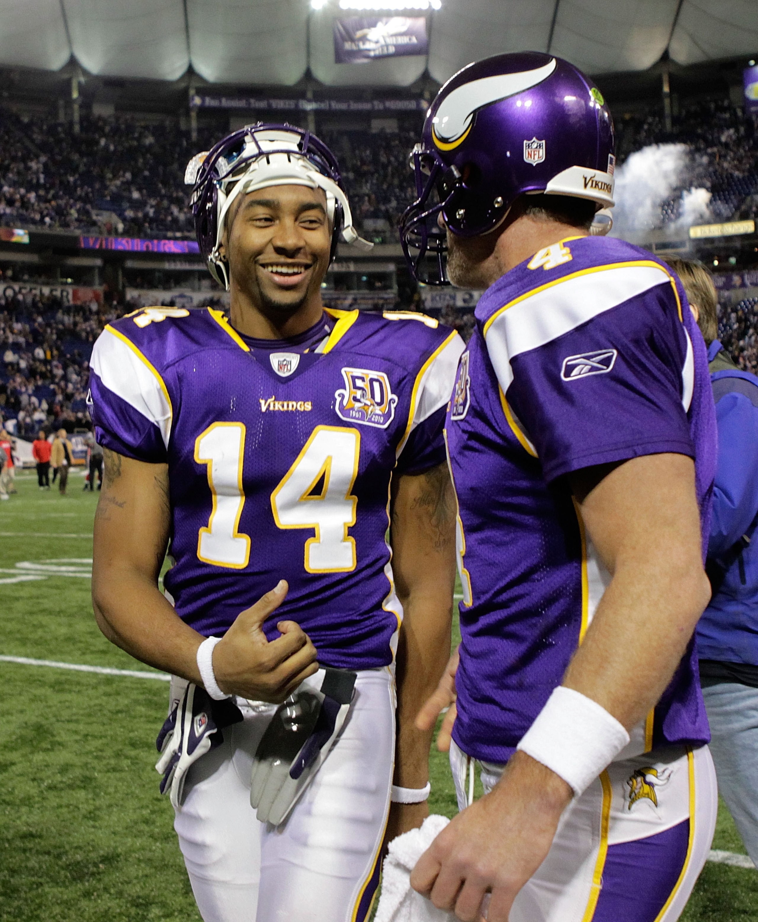 MINNEAPOLIS, MN - DECEMBER 05:  Brett Favre #4 of the Minnesota Vikings talks with teammate Joe Webb #14 as they leave the field after defeating the Buffalo Bills at the Mall of America Field at the Hubert H. Humphrey Metrodome on December 5, 2010 in Minn