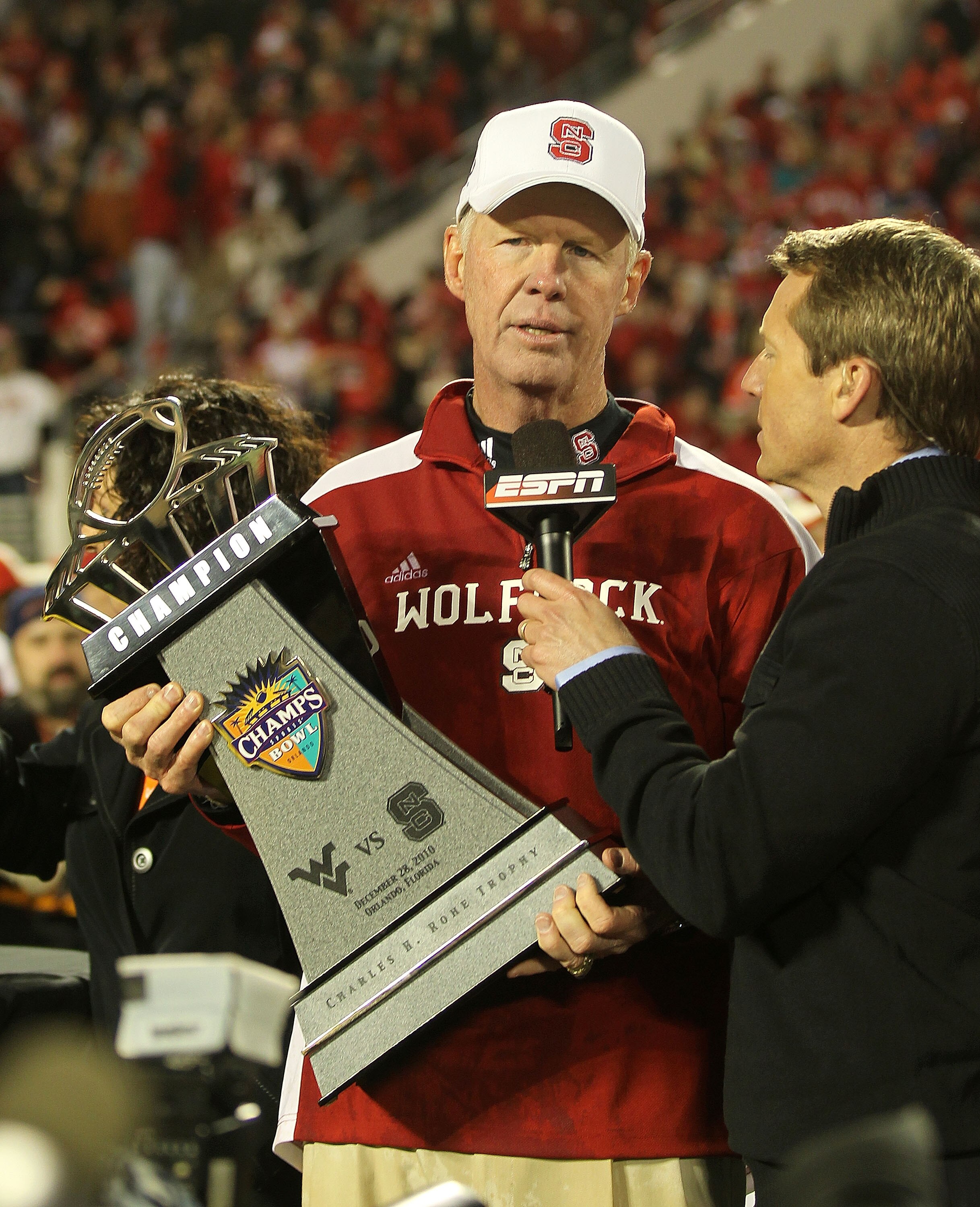 ORLANDO, FL - DECEMBER 28: North Carolina State Wolfpack head coach Tom O'Brien celebrates after winning  the Champs Sports Bowl against the West Virginia Mountineers at Florida Citrus Bowl Stadium on December 28, 2010 in Orlando, Florida.  (Photo by Mike