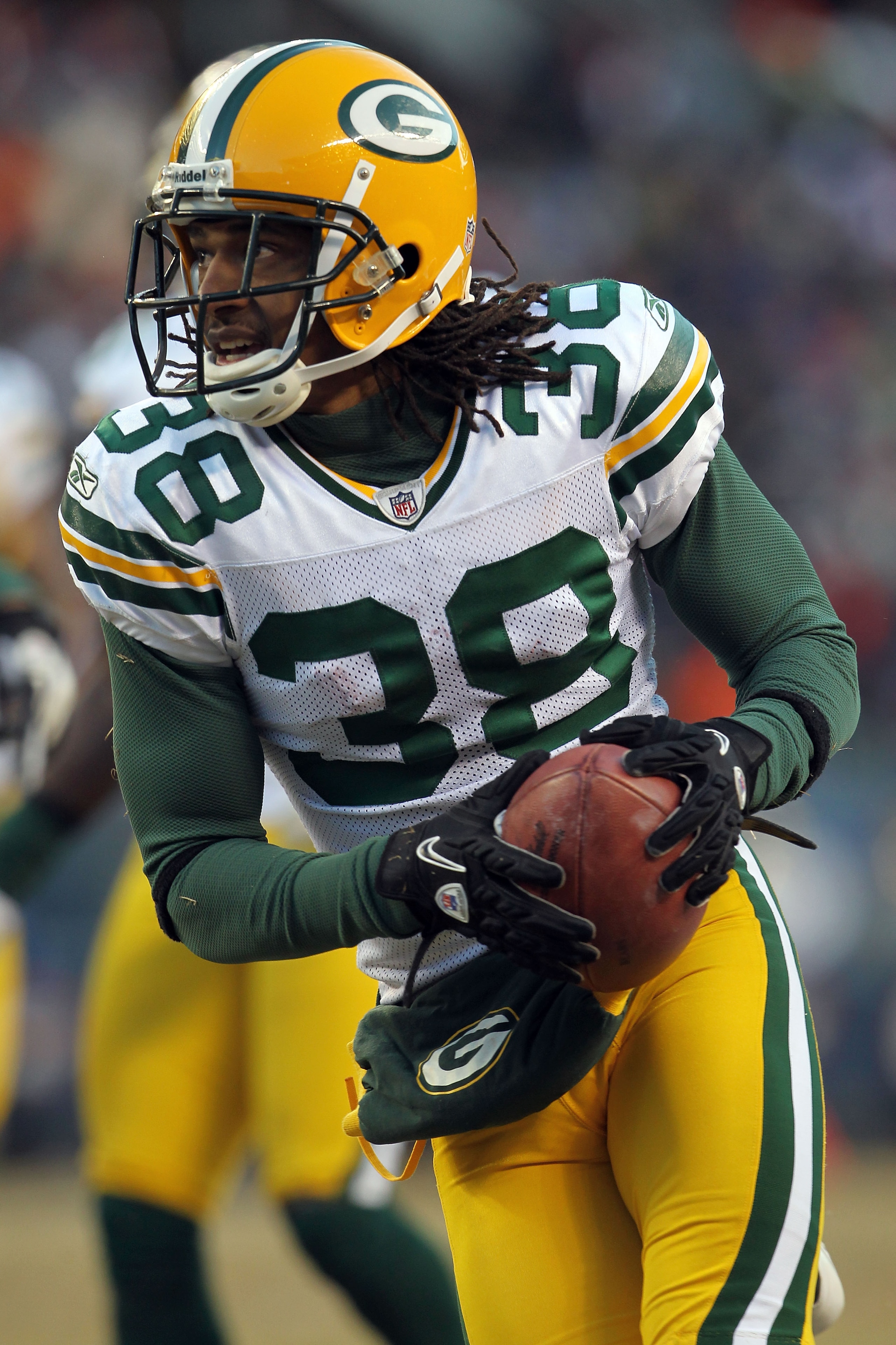 CHICAGO, IL - JANUARY 23:  Tramon Williams #38 of the Green Bay Packers returns a kick against the Chicago Bears in the NFC Championship Game at Soldier Field on January 23, 2011 in Chicago, Illinois.  (Photo by Jamie Squire/Getty Images)