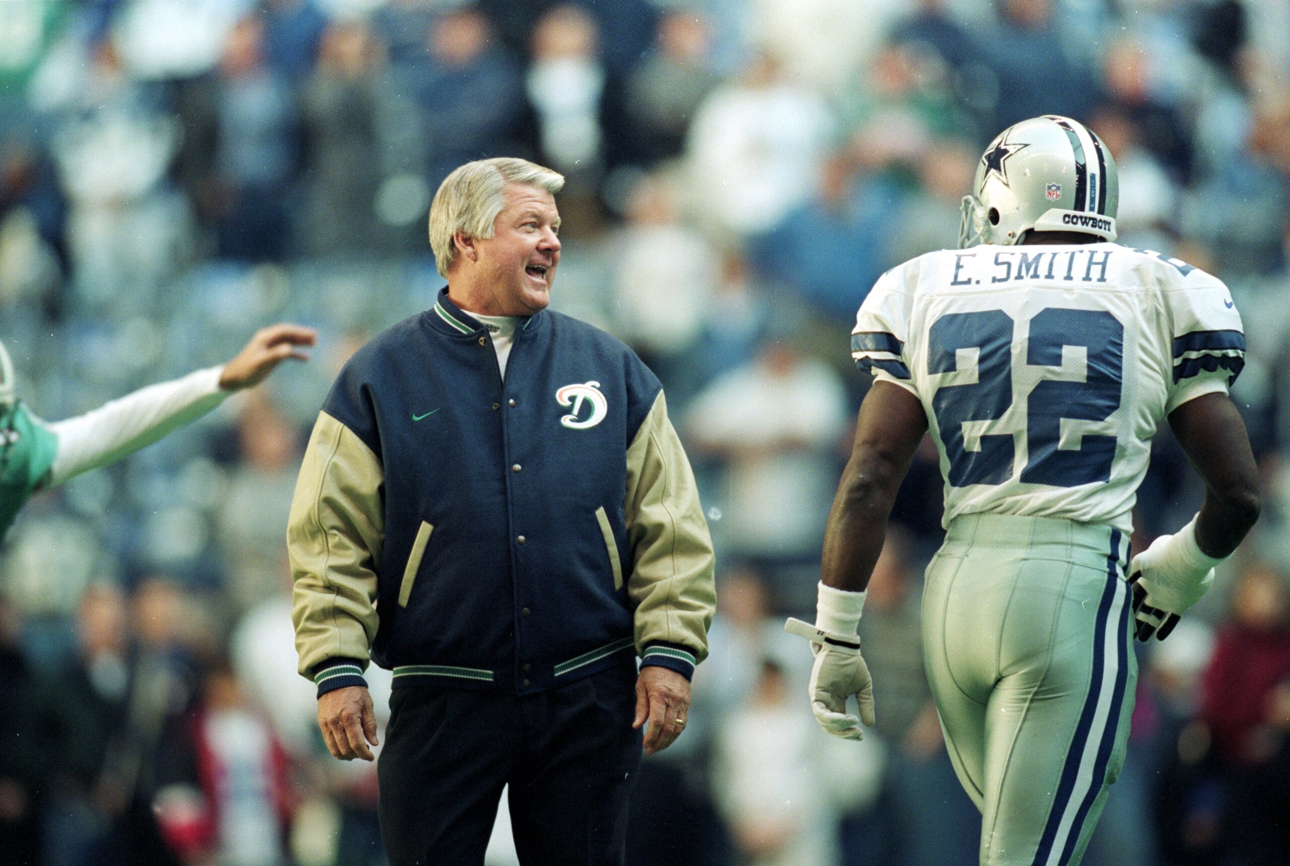 25 Nov 1999: Coach Jimmy Johnson of the Miami Dolphins talks to Emmitt Smith #22 of the Dallas Cowboys as he walks onto the field during the game at the Texas Stadium in Irving, Texas. The Cowboys defeated the Dolphins 20-0.