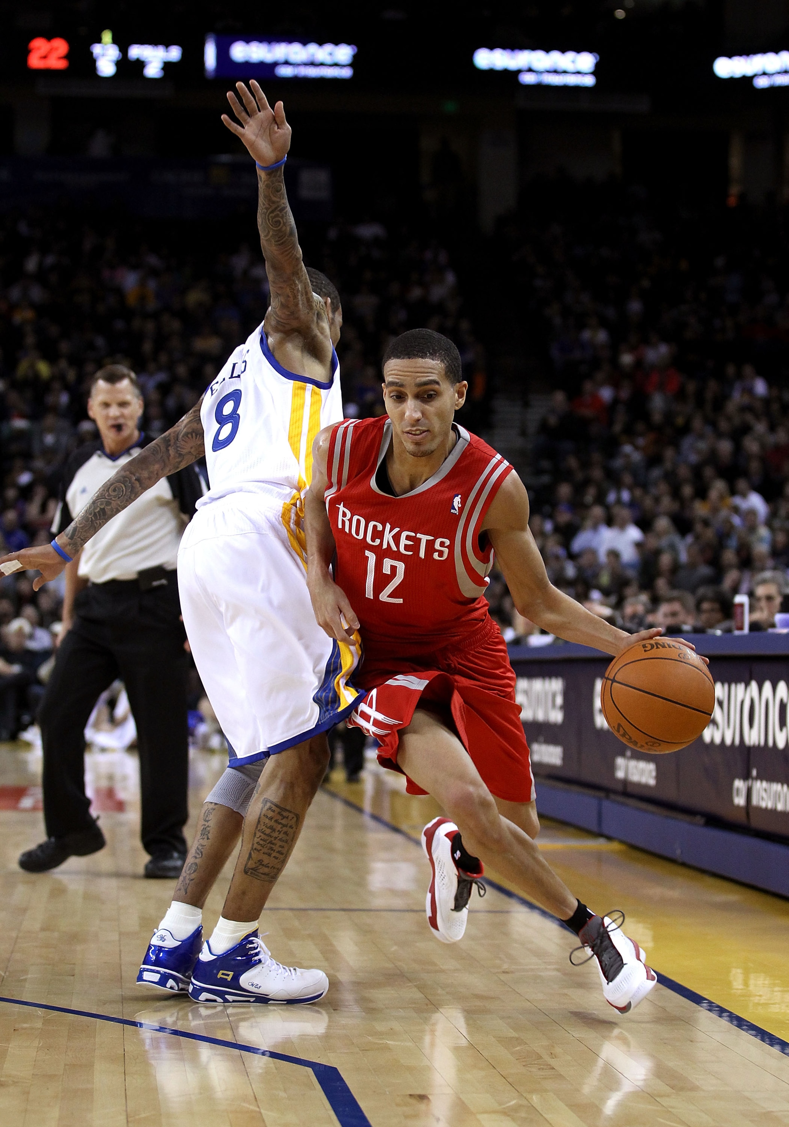 OAKLAND, CA - DECEMBER 20:  Kevin Martin #12 of the Houston Rockets dribbles around Monta Ellis #8 of the Golden State Warriors at Oracle Arena on December 20, 2010 in Oakland, California. NOTE TO USER: User expressly acknowledges and agrees that, by down